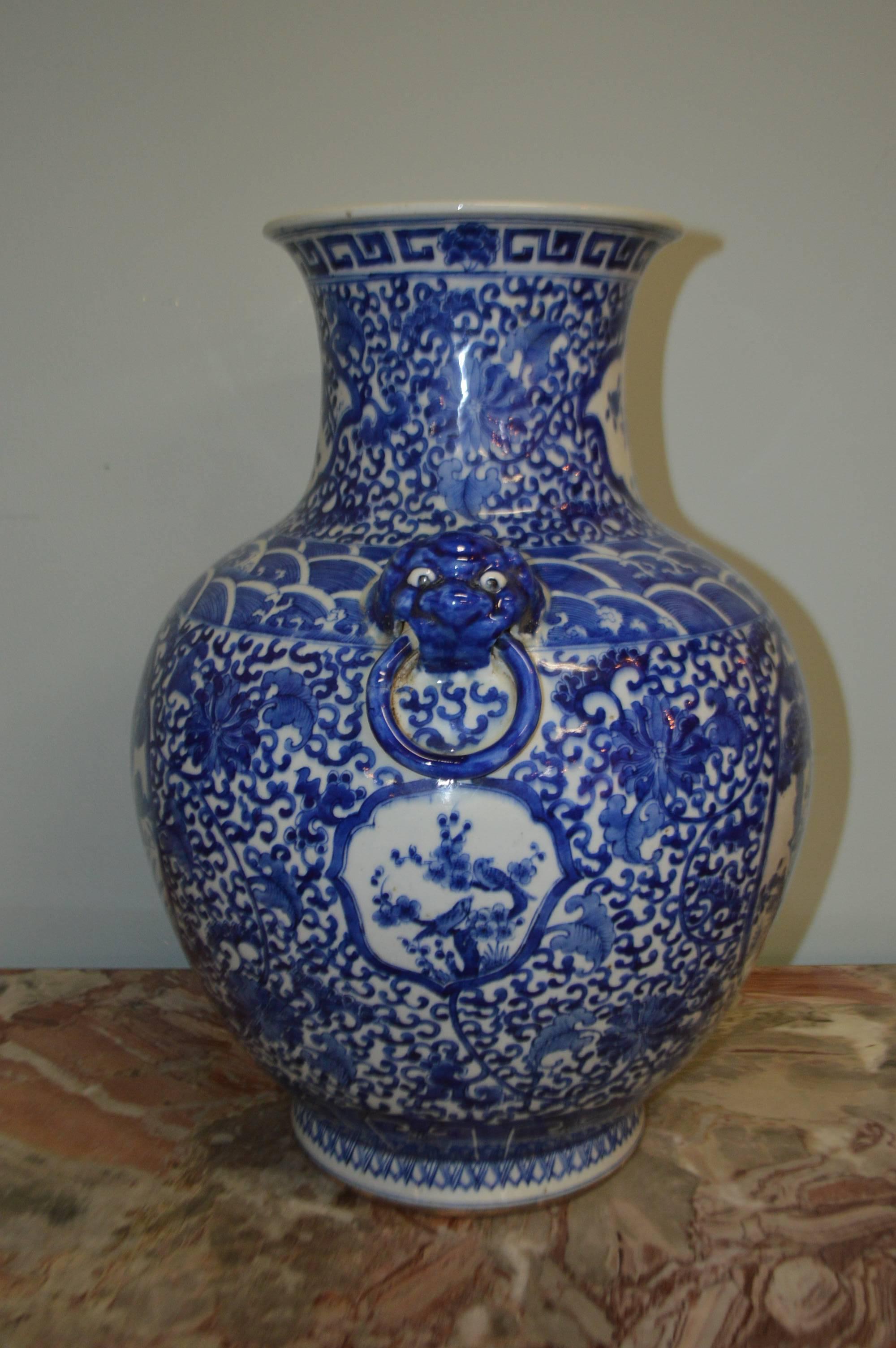 Decorative blue and white large Chinese vase, having two figural subjects on each side of the vase representing elders listening to music. There are two Foo handles on each side.
Maker marking under the vase.