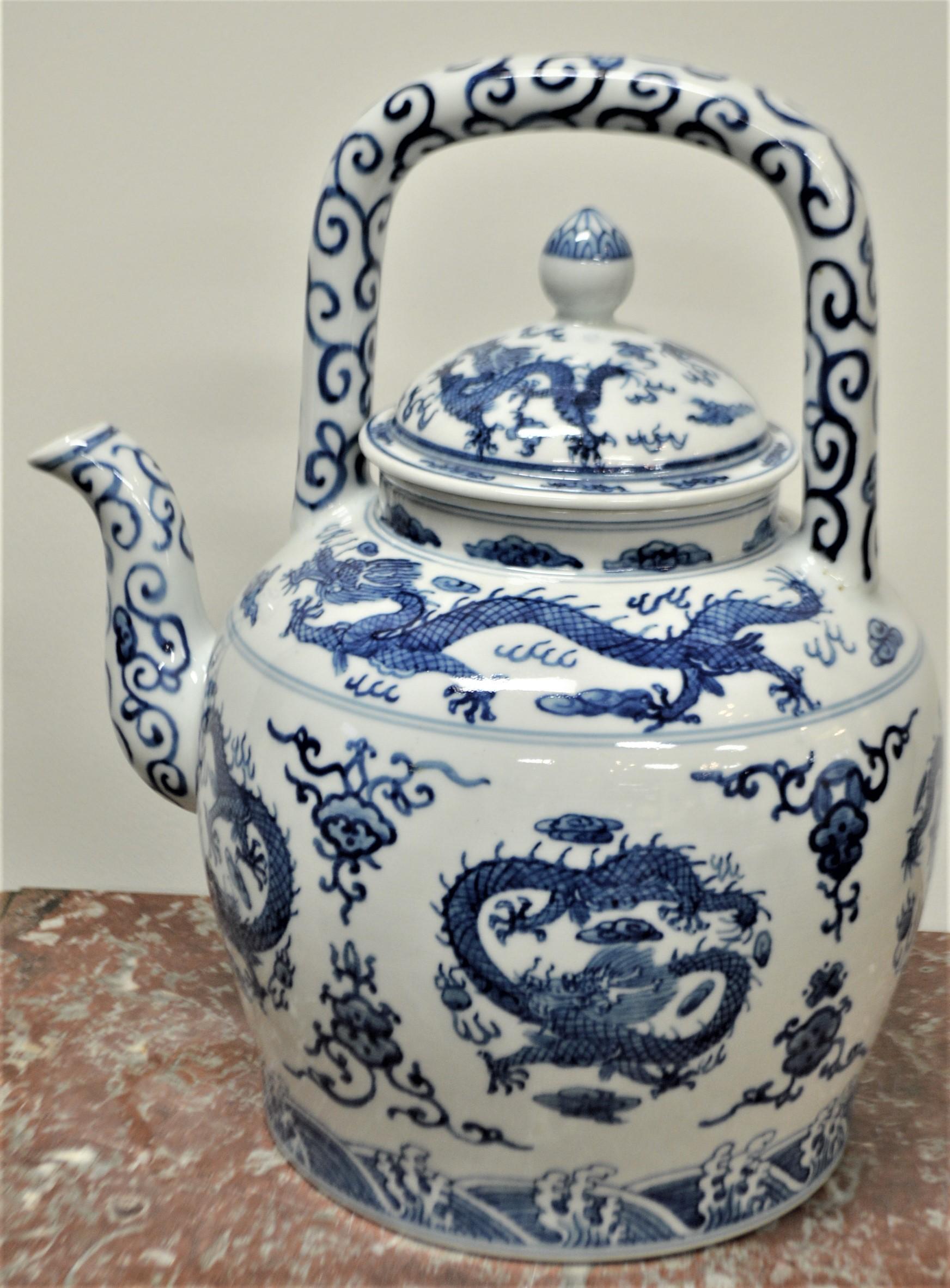 Highly decorative blue and white large porcelain Chinese tea pot. New condition.
Amusing dragon design painted on the porcelain. Chinese marking under, see photo.
