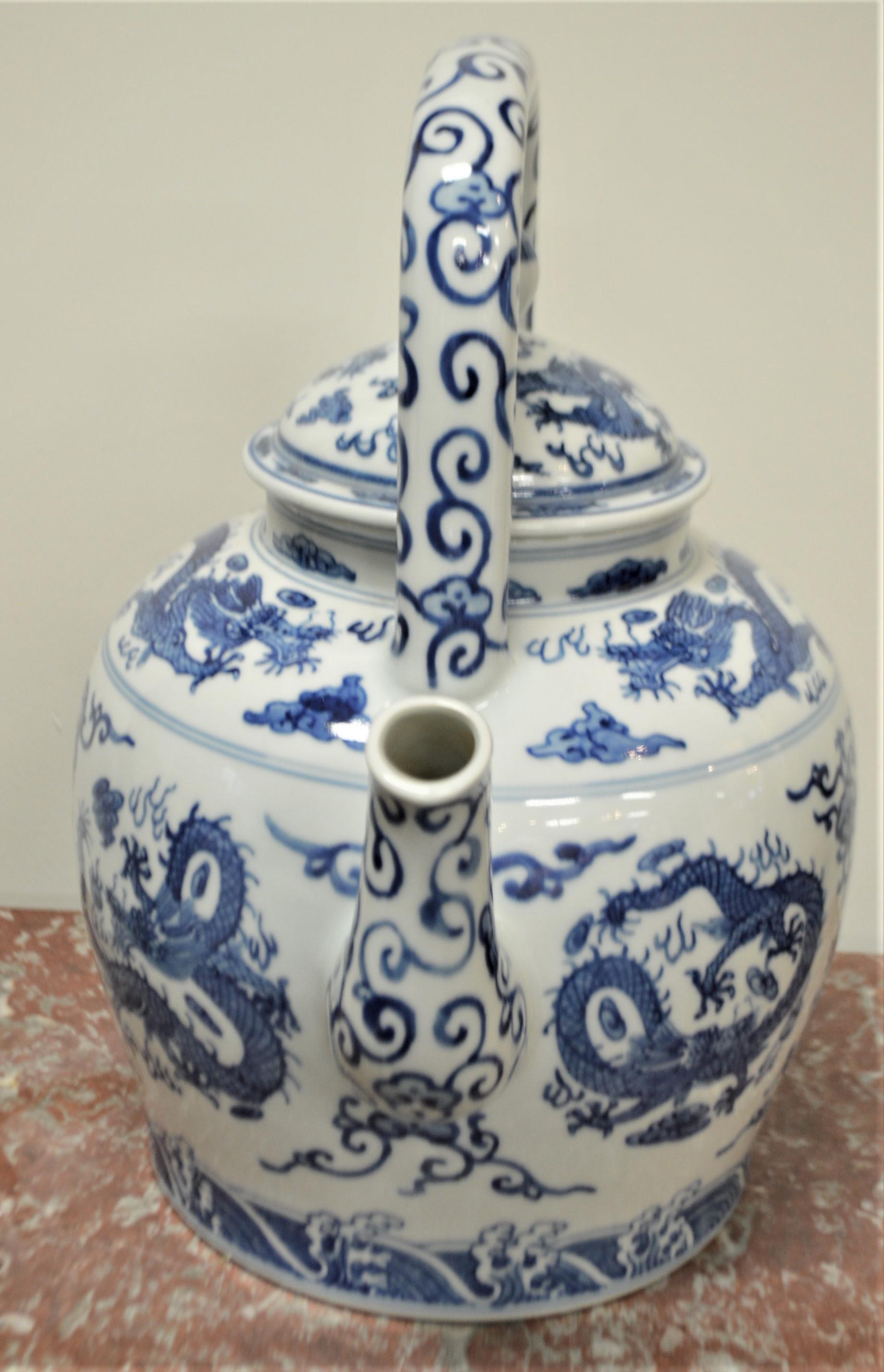blue and white porcelain tea pot with dragon motif