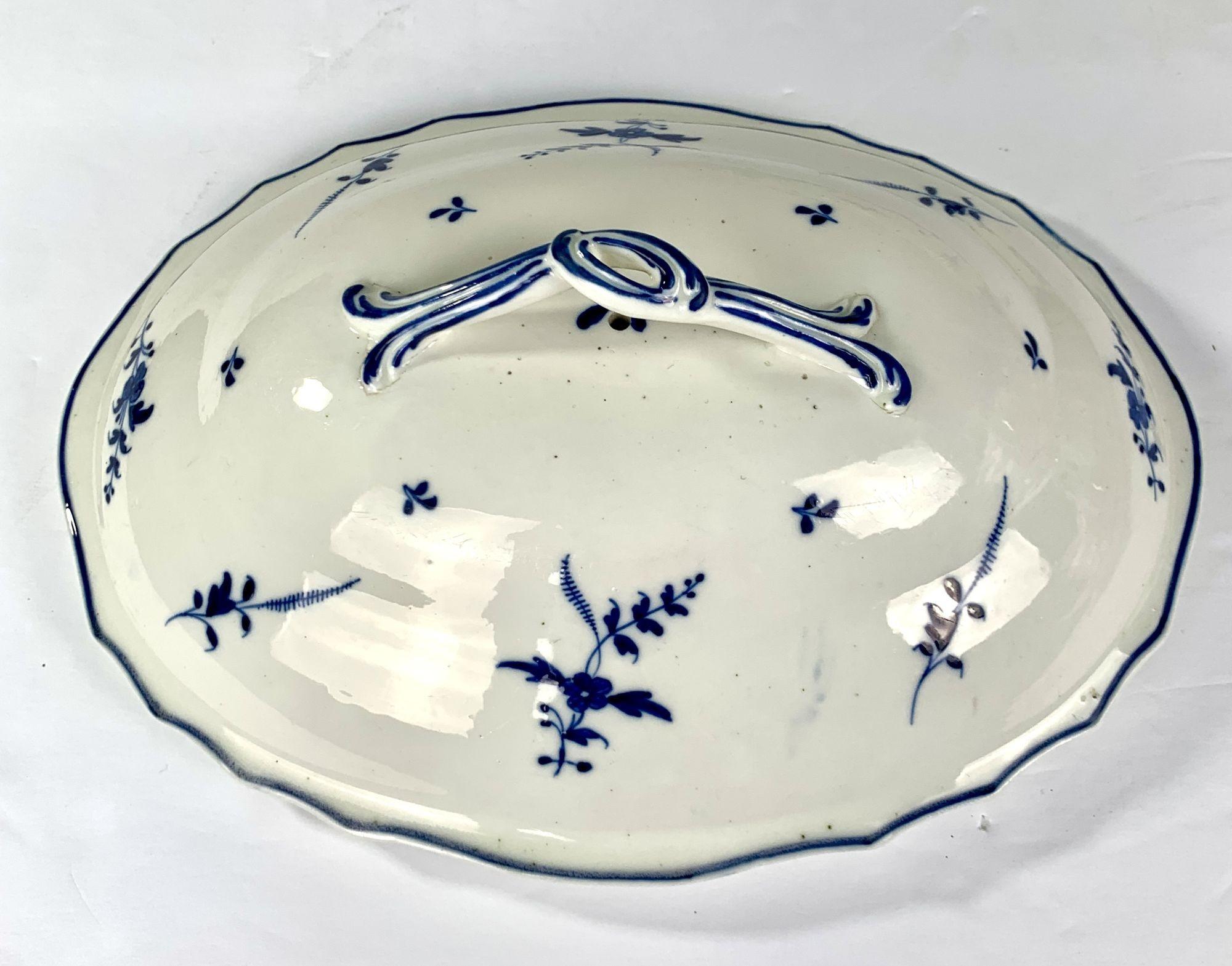   Decorated with an elegant design of delicate blue cornflower sprigs, this soup tureen was made by Arras Porcelain in Arras, France, in the late 18th century.
The cornflower sprigs, handles, and border edging are decorated with beautiful deep