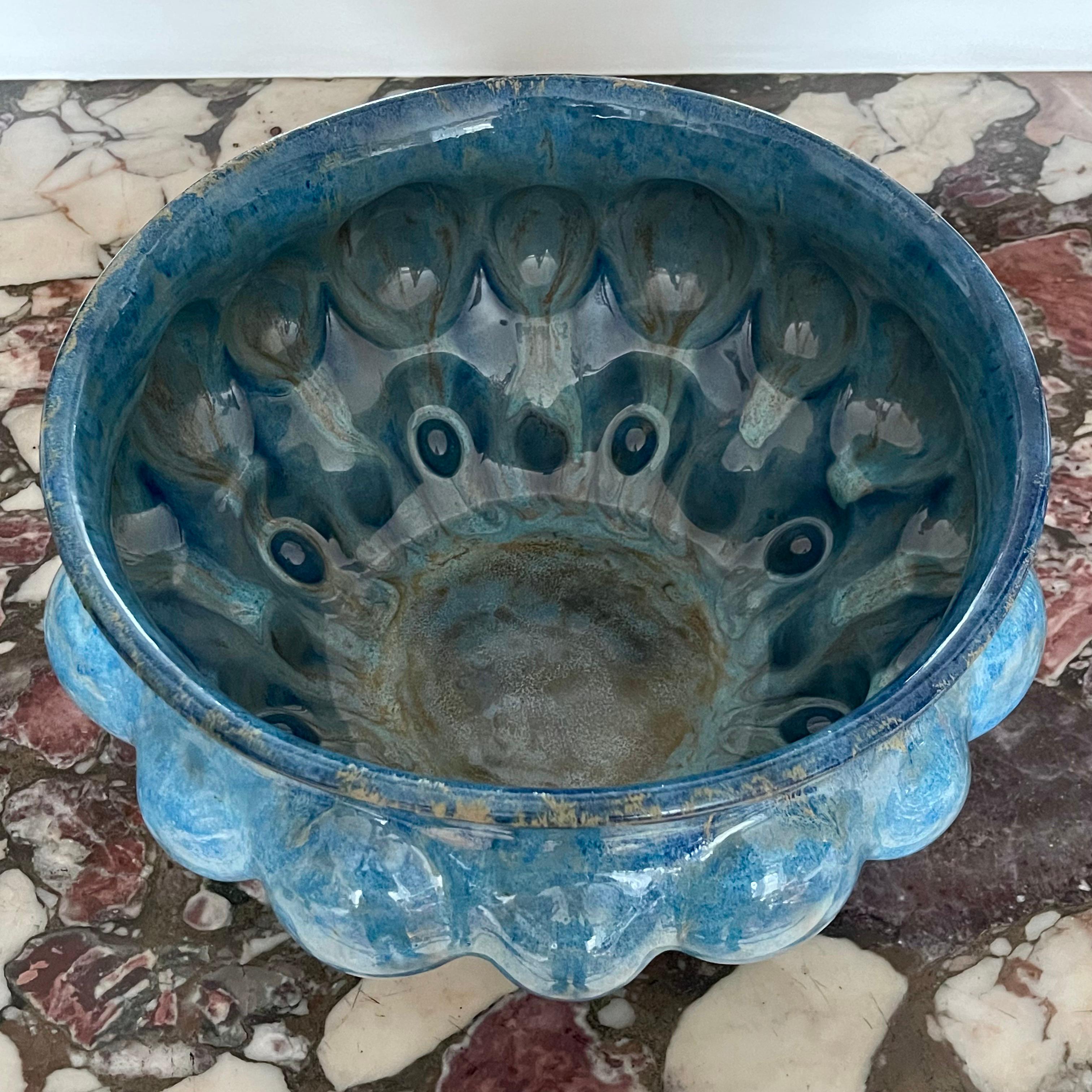 Violante Lodolo D'Oria, Variegated Aqua Blue Rosetta Vessel, 2024, glazed stoneware, multiple glazes,  W41cm x H25cm

New stunning piece created by ceramic artist Violante Lodolo d' Oria. The layering of different glazes creates shimmering and