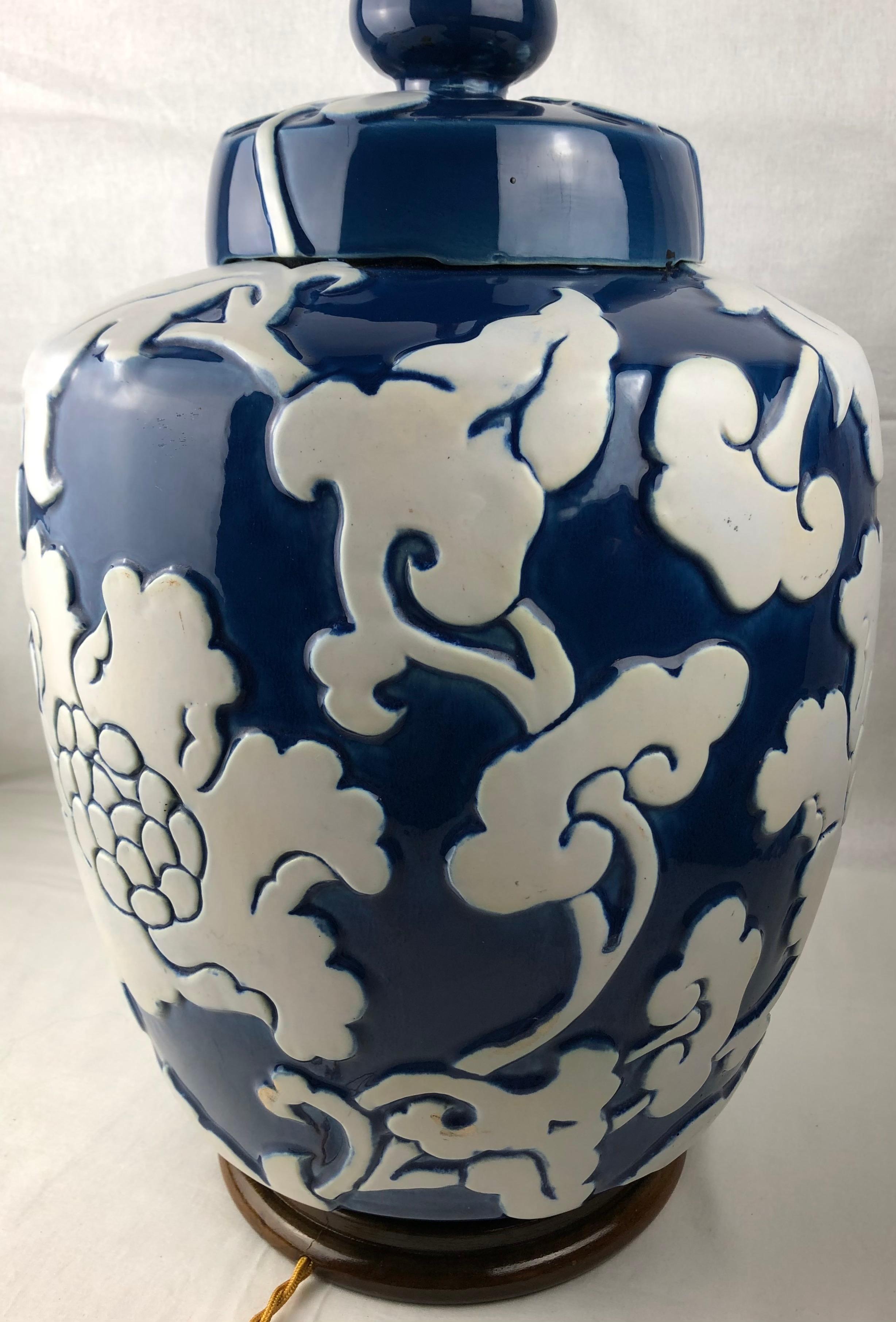 Varnished Large Blue-Glazed French Porcelain Table Lamp with High Relief Motifs For Sale