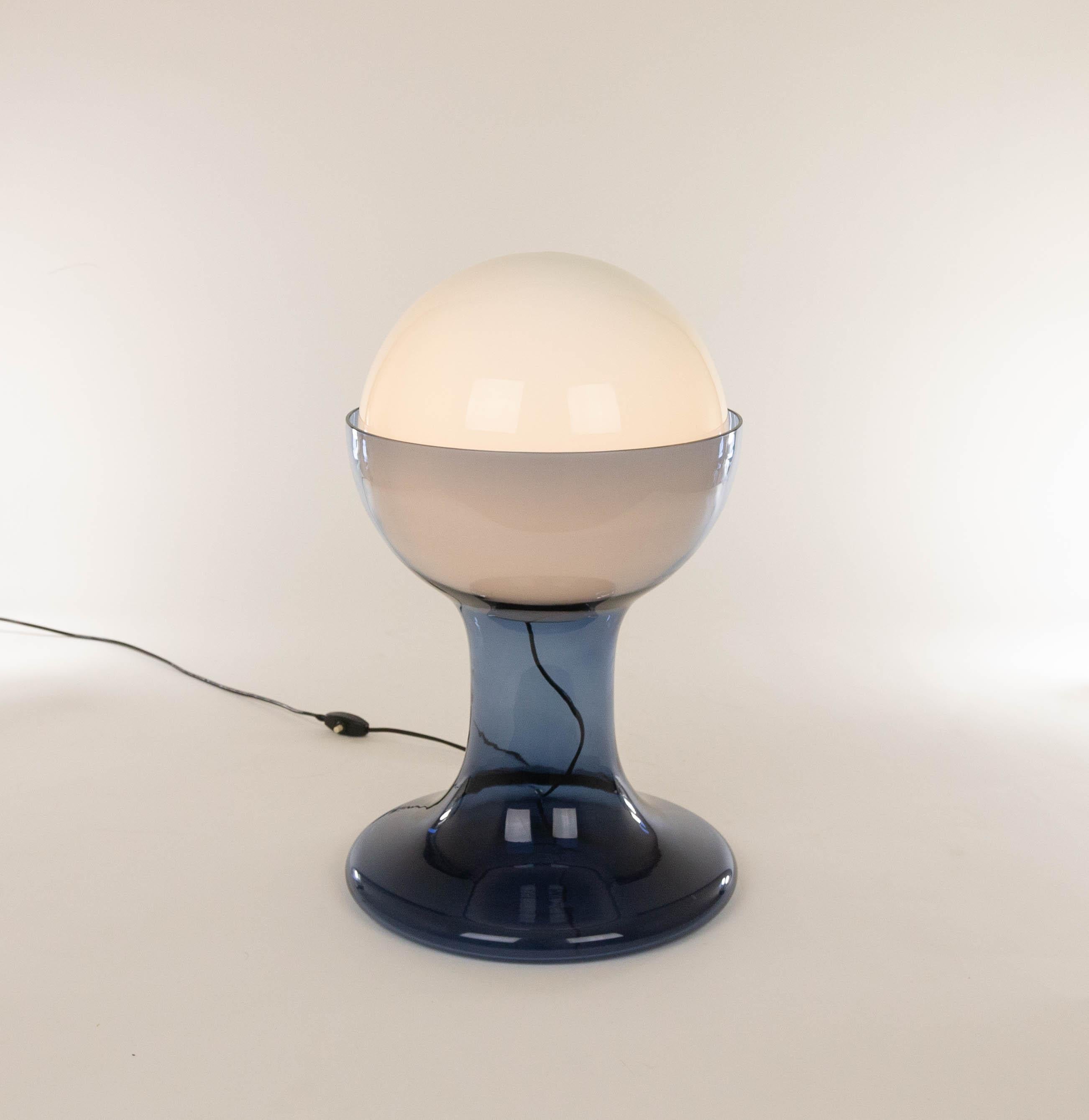 Large blue LT 216 table lamp designed by Carlo Nason and manufactured in the 1960s by Murano glassmaker A.V. Mazzega. The lamp is made of white opaline glass globe and a blue Murano glass base.

This model was produced in two sizes; LT 216 is the