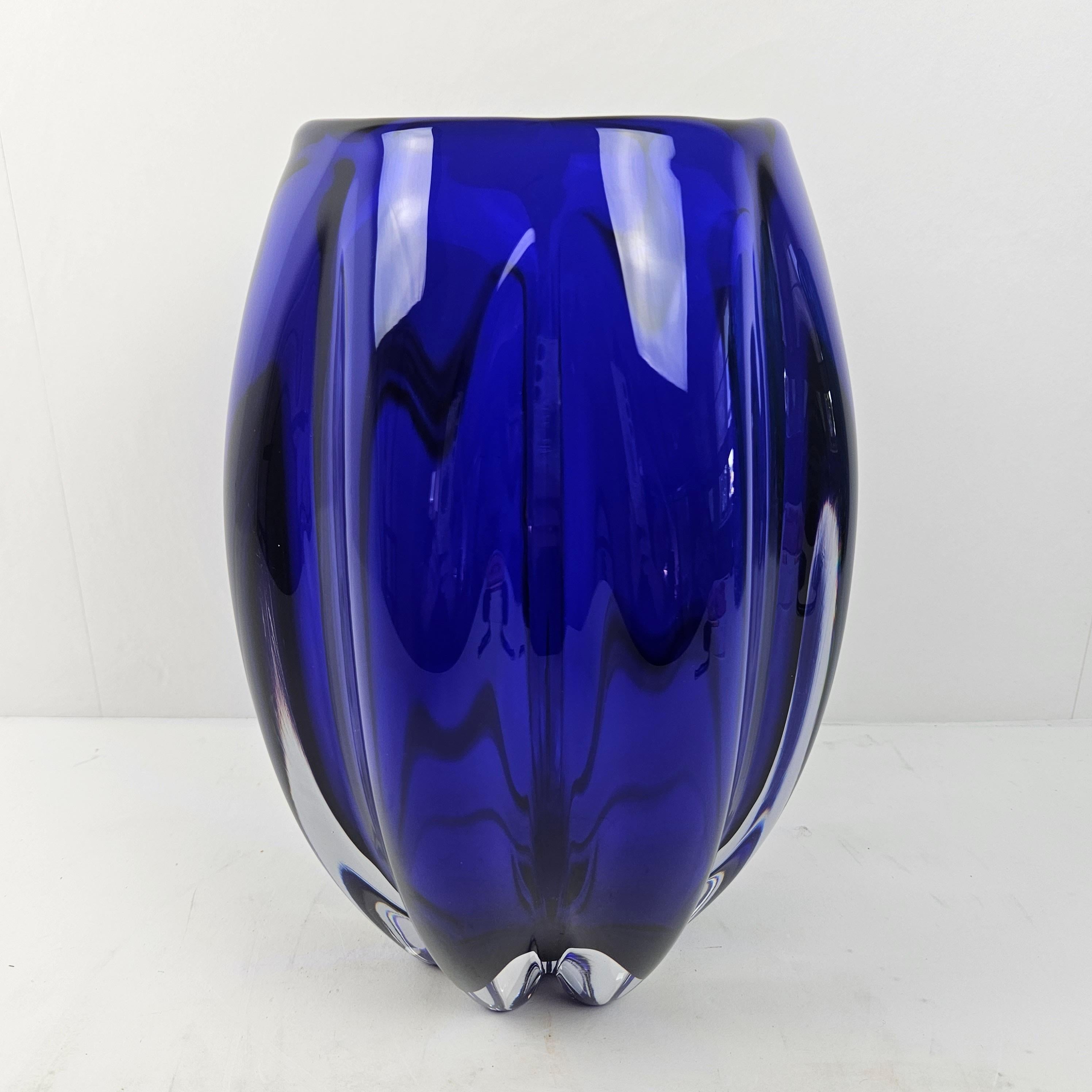 Beautiful deep blue colored Murano glass vase.
Fabricated by Cenedese in the late 90's, Venetia Italy.

This stunning vase has been hand-blown by skilled artisans in Murano, Italy who use traditional techniques dating back to the 13th century. It