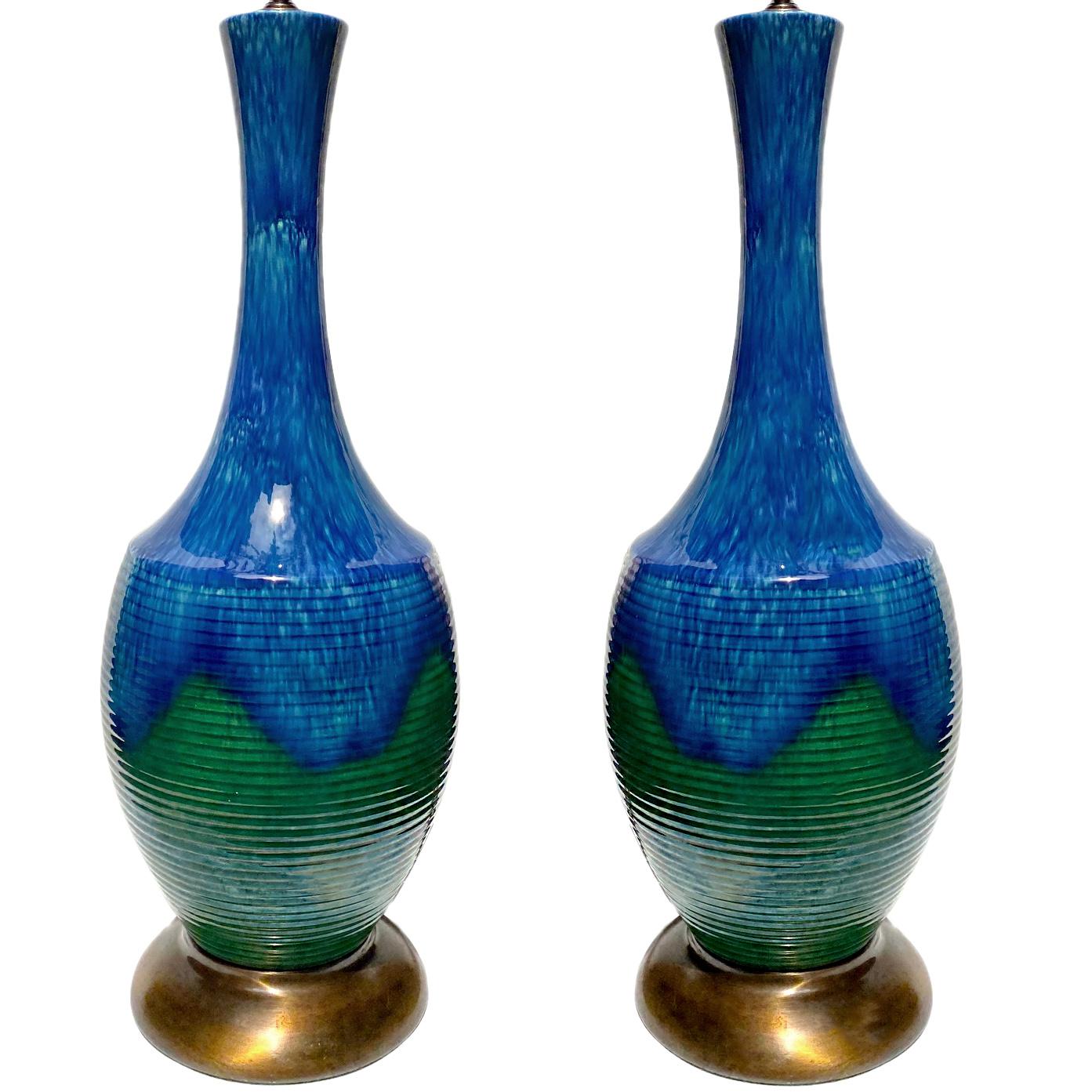 Pair of circa 1950's Italian two-tone glazed porcelain table lamps with blue and green hues.

Measurements:
Height of body: 24.5