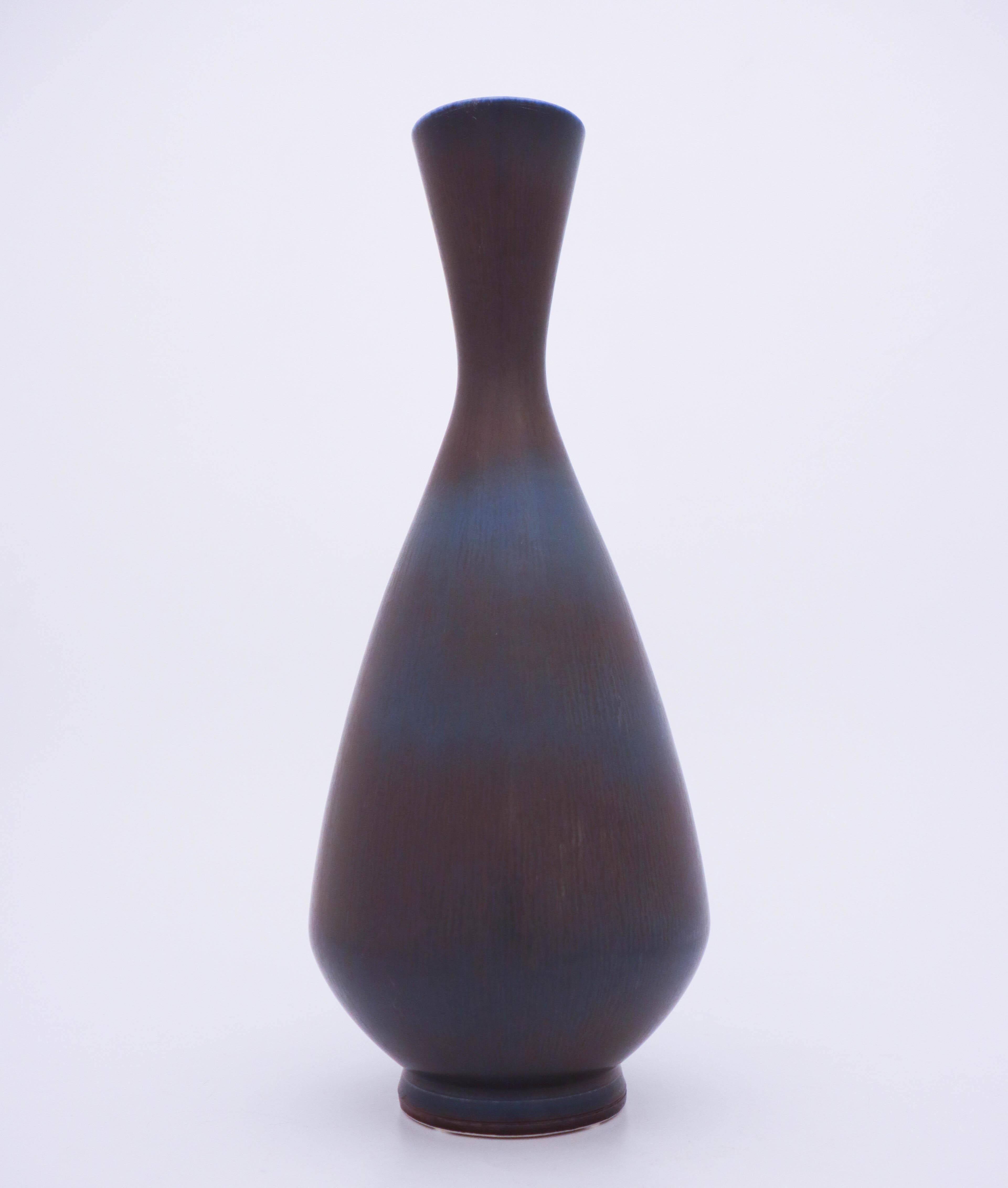 A blue vase designed by Berndt Friberg at Gustavsberg in Stockholm, the vase is 37.5 cm high and 15 cm in diameter. It has a beautiful hare’s fur glaze and marked as on picture. This vase was produced in 1962, it´s in mint condition!