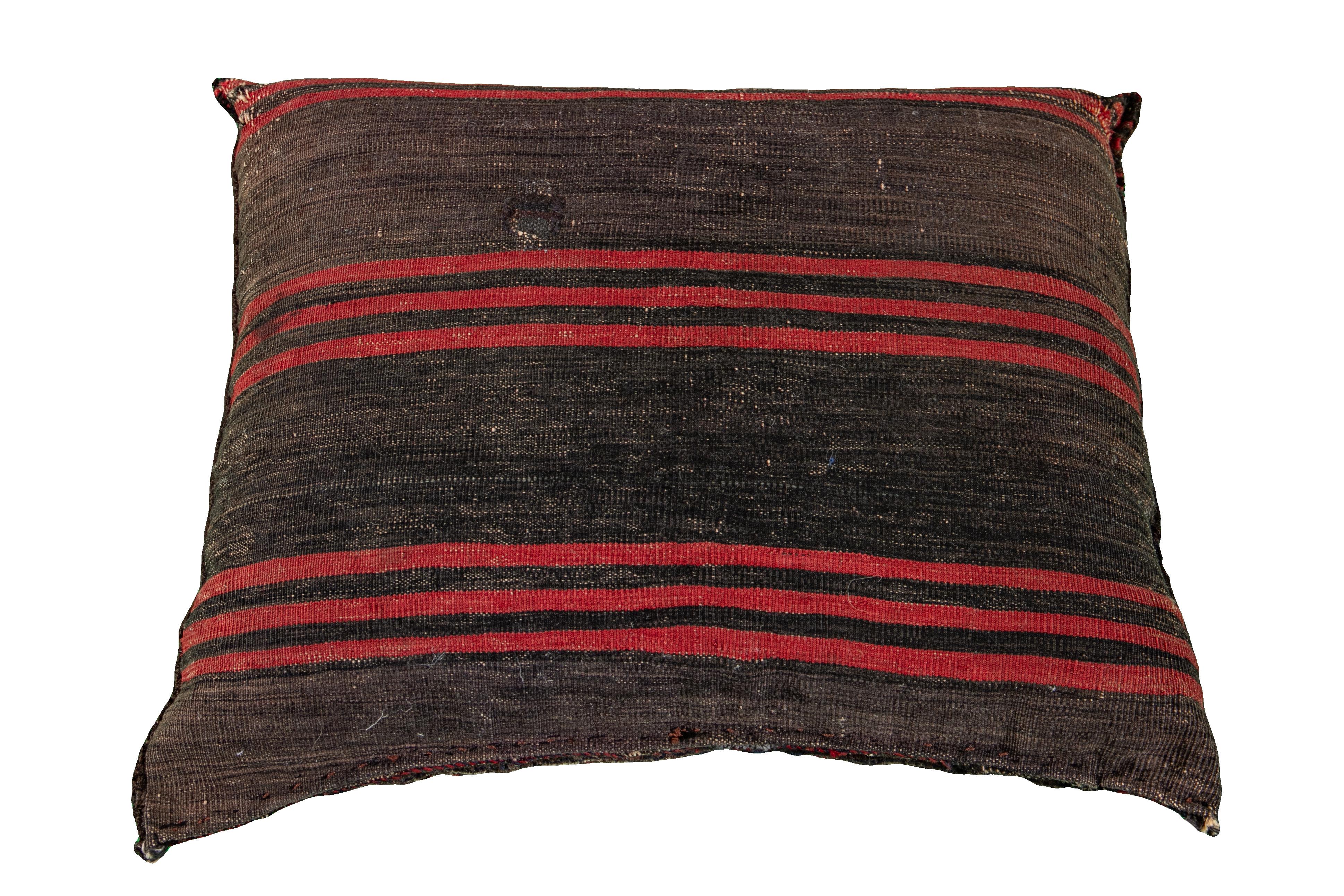 Beautiful vintage Persian Turkmen handmade pillow with a blue, gray field and accents of red, orange, and brown. This Turkmen Pillow features a Vintage take on a Classic design motif in vibrant colors to produce a vigorous experience of oriental