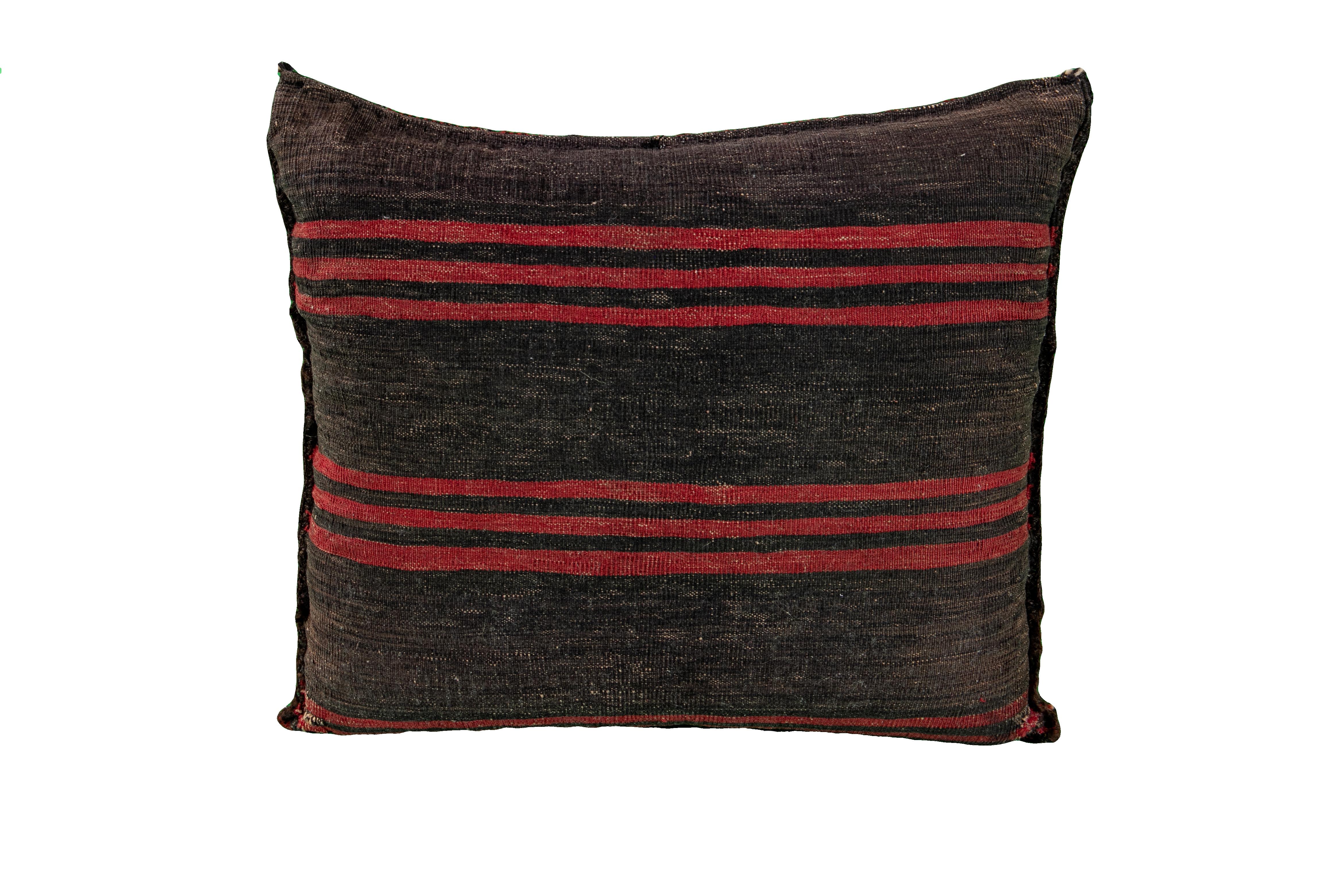 Beautiful vintage Persian Turkmen handmade pillow with a blue, gray field, and accents of red, orange, and brown. This Turkmen pillow features a vintage take on a Classic design motif in vibrant colors to produce a vigorous experience of oriental