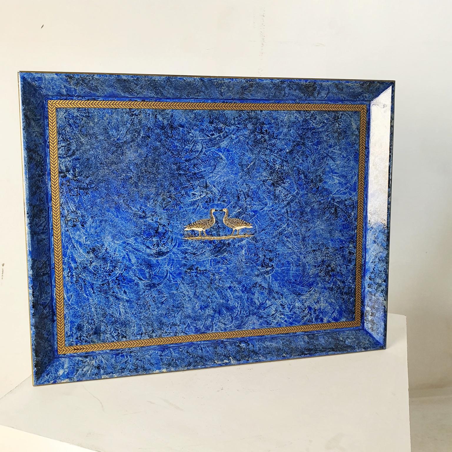 A large rectangular handcrafted serving tray in blue with a border in gold and center featuring a pair of geese. In excellent unused condition.