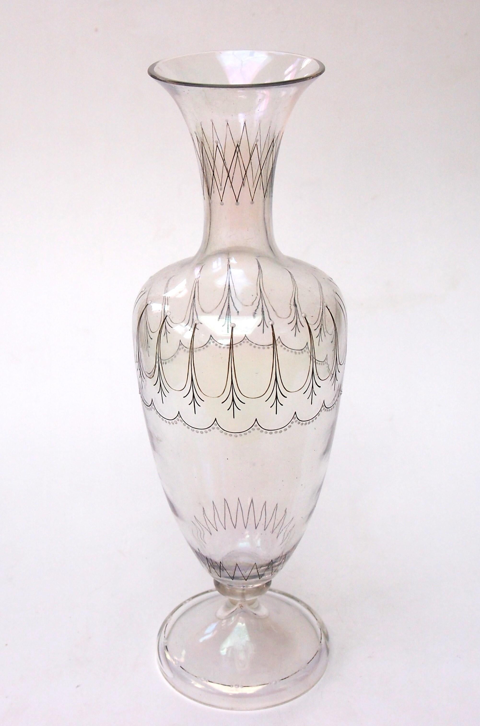 A large rare early Victorian Harrach Glatt Iris vase made for Lobmeyr by Harrach, With an iridised petrol finish and black and white stylised enamelling. The Glatt iris range was the first commercially make iridised glass copying the look of 'found'