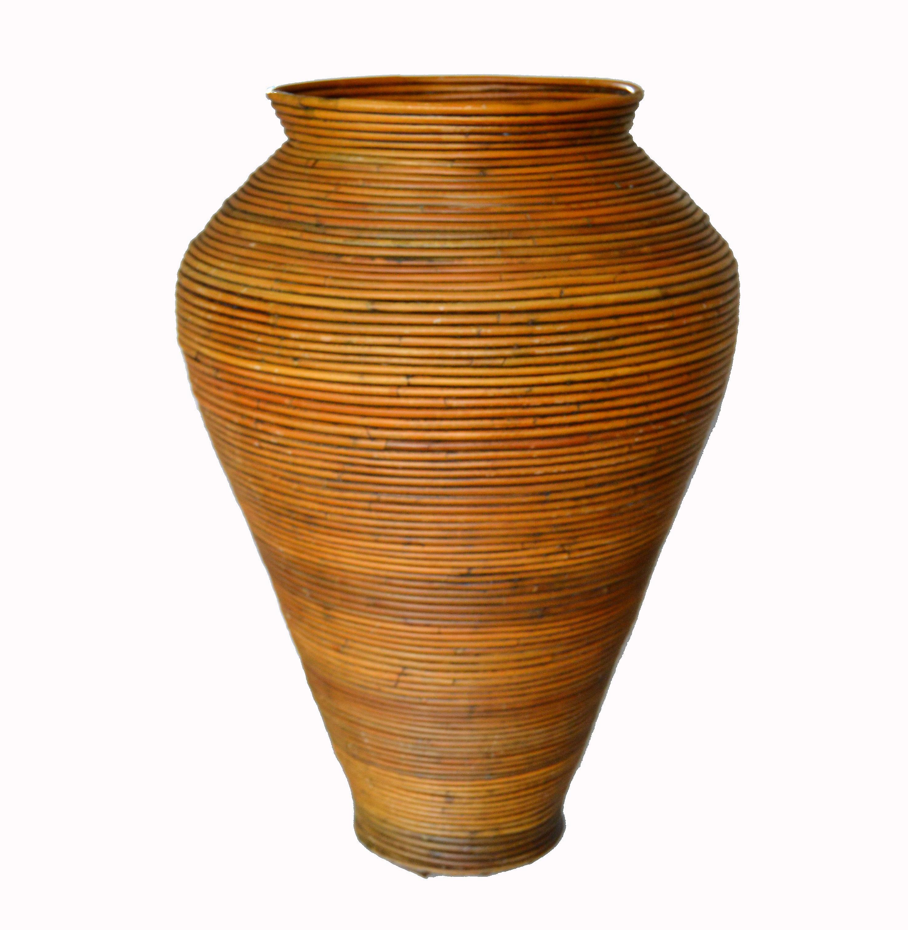 Handcrafted tall boho chic tan pencil reed bamboo floor vase in cone shape.
Great addition for Your Sunroom.