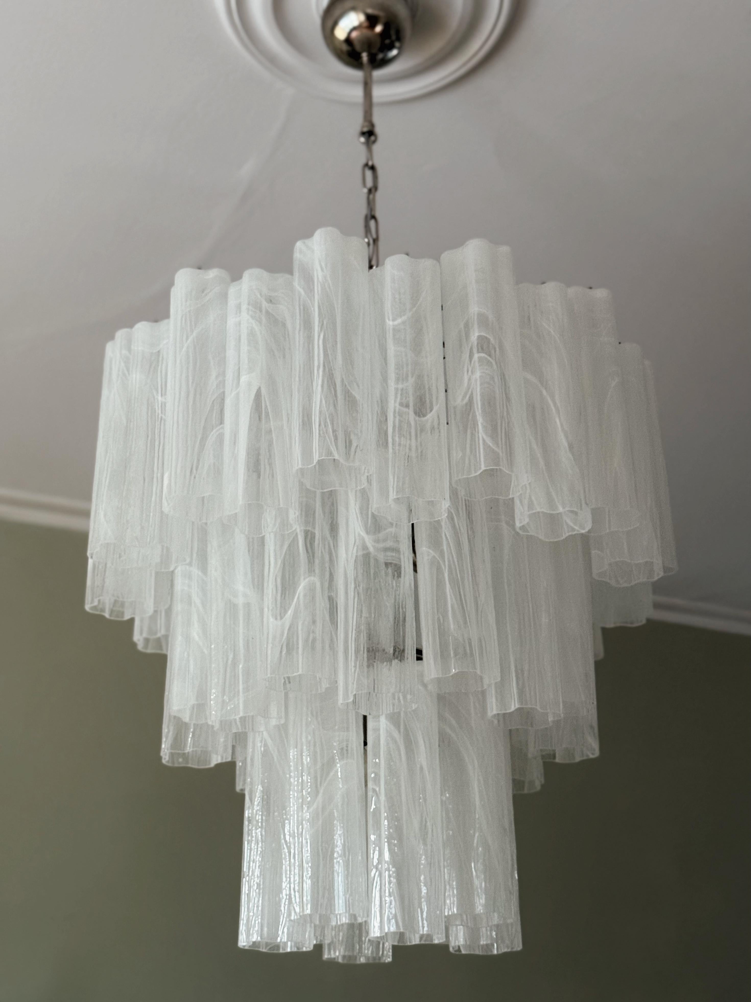 White Statement Murano Chandelier with glass tubes in a swirled marble pattern. Tronchi Formed Glass Prisms in Traditional Italian Mid-Century Style.
The murano fixture is composed of 48 Glass Elements in the size of 25 x7 cm (9.9