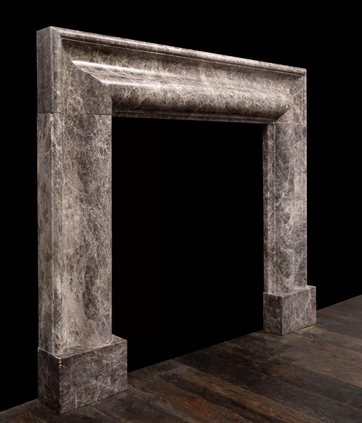 Northern Irish large bolection mantel of Emperador marble produced by Ryan & Smith For Sale