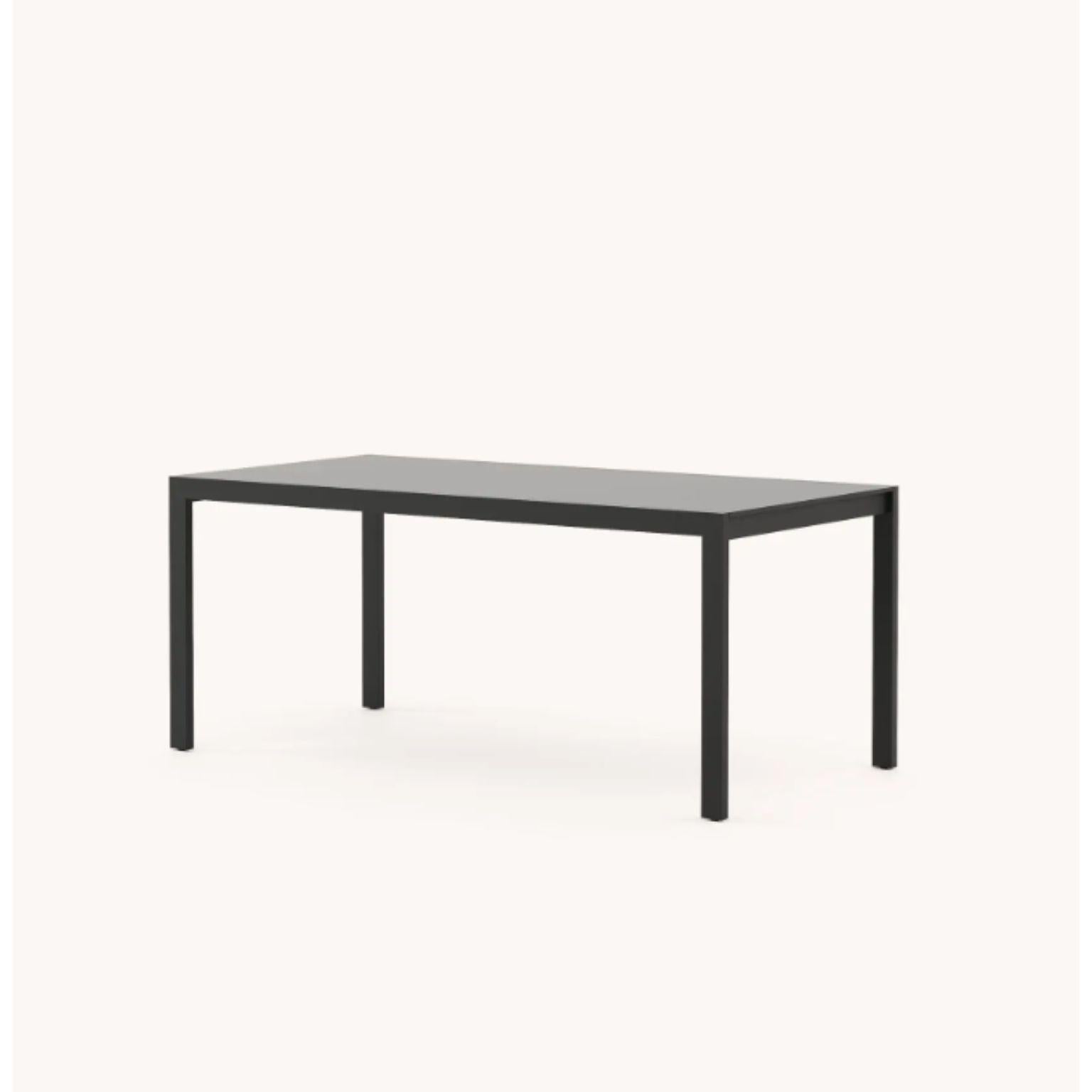 Large bondi dining table by Domkapa
Materials: black texturized steel, black lacquered.
Dimensions: W 220 x D 120 x H 78 cm.
Also available in different materials. 

Gather your friends and family and celebrate summer with comfort and style