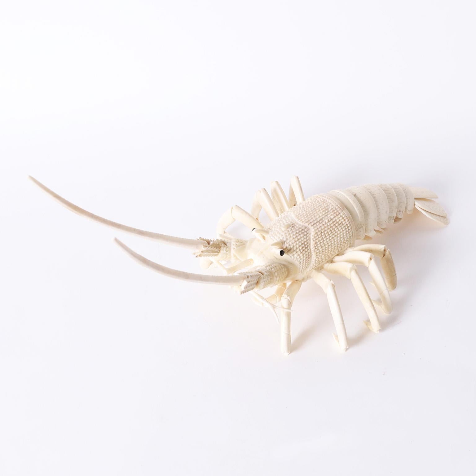Lofty large articulated lobster sculpture or object of art crafted in carved bone with hinged antennae and flexible tail.