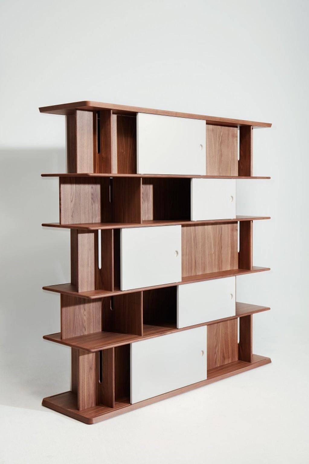 Large bookshelf by Neri & Hu
Dimensions: W 201 x D 55 x H 200 cm
Materials: Canaletto walnut veneer wood
Doors: Dark green, prune, warm white lacquered mdf

Founded in 2004 by partners Lyndon Neri and Rossana Hu, Neri&Hu Design and Research