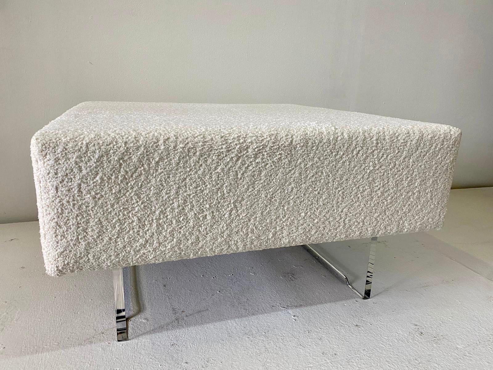 Simple and classic design for this square ottoman in fresh boucle fabric and on two lucite legs. Clean and perfect for any design and decor.