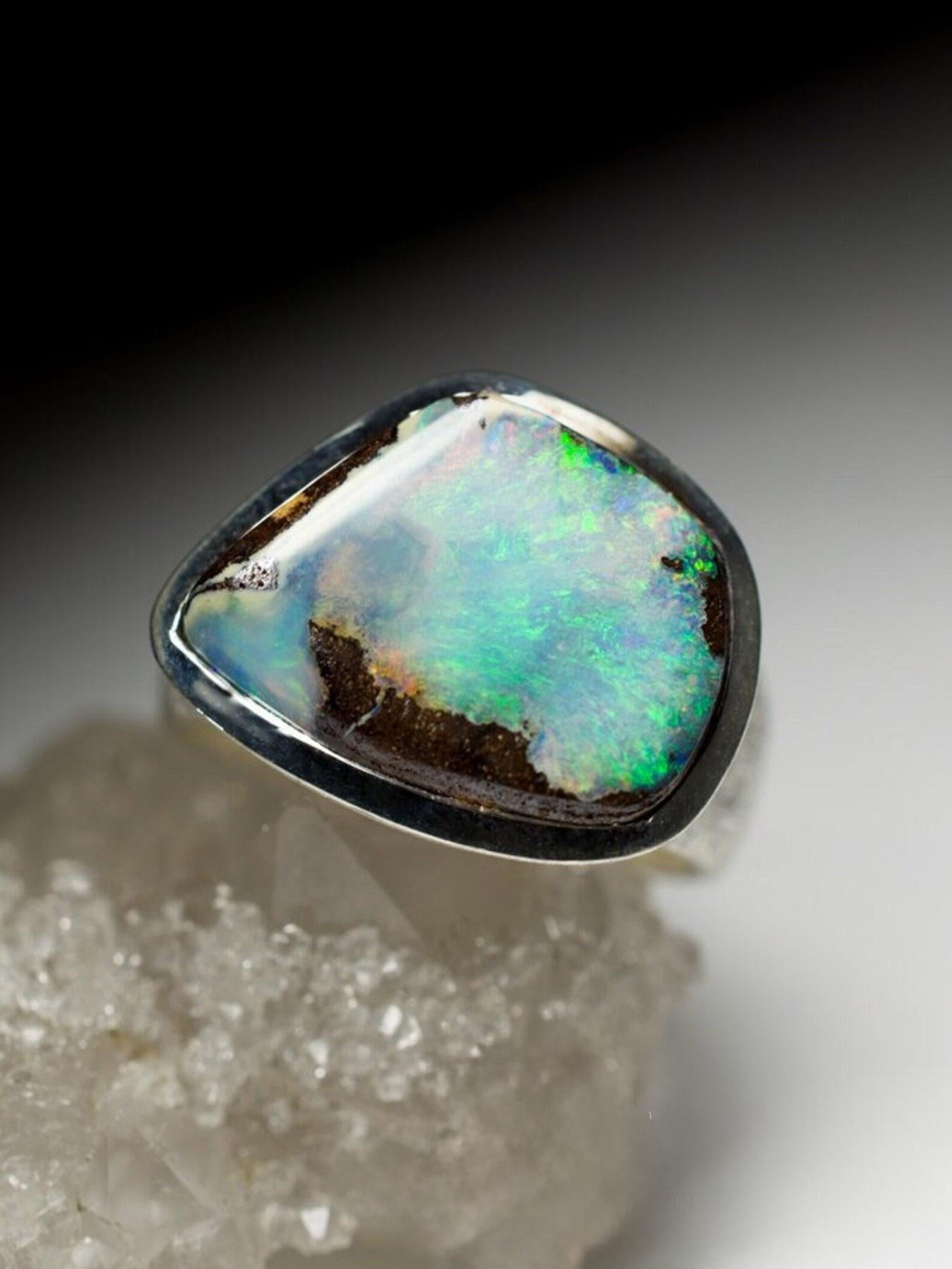 Large matte finish silver ring with natural Boulder Opal
opal origin - Australia 
opal weight - 10.6 carats
ring weight - 8.05 grams
ring size - 8 1/4 US
opal measurements - 0.2 х 0.51 x 0.67 in / 5 x 13 x 17 mm