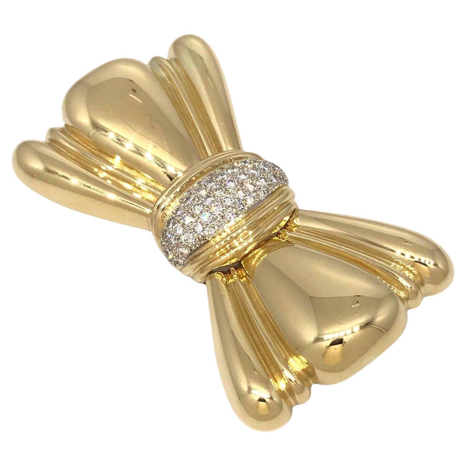 Large Bow Pin Brooch with Pave Diamonds in 18k Yellow Gold

Large Bow Pin with Diamonds features a Bow Design in High polished 18k Yellow Gold with the bow knot encrusted with 1.50 carats of Round Full cut Diamonds Pave set.

Pin measures 2.75