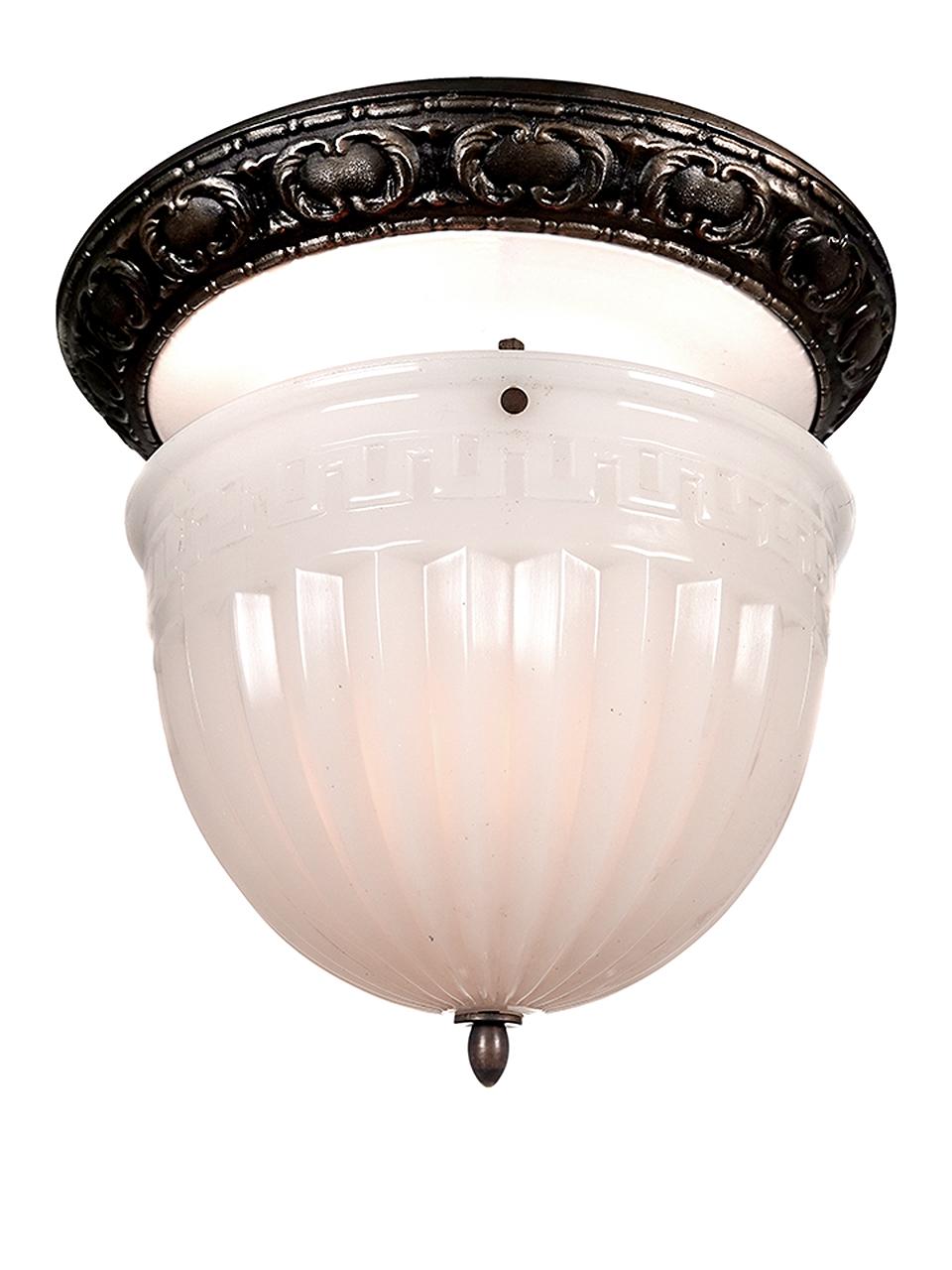 Brascolite fixtures have always been popular because of their quality glass and construction. The large dome with its fluted and Greek Key pattern is almost .5 in thick. The ceiling crown is white porcelain with a decorative iron ring. The look is