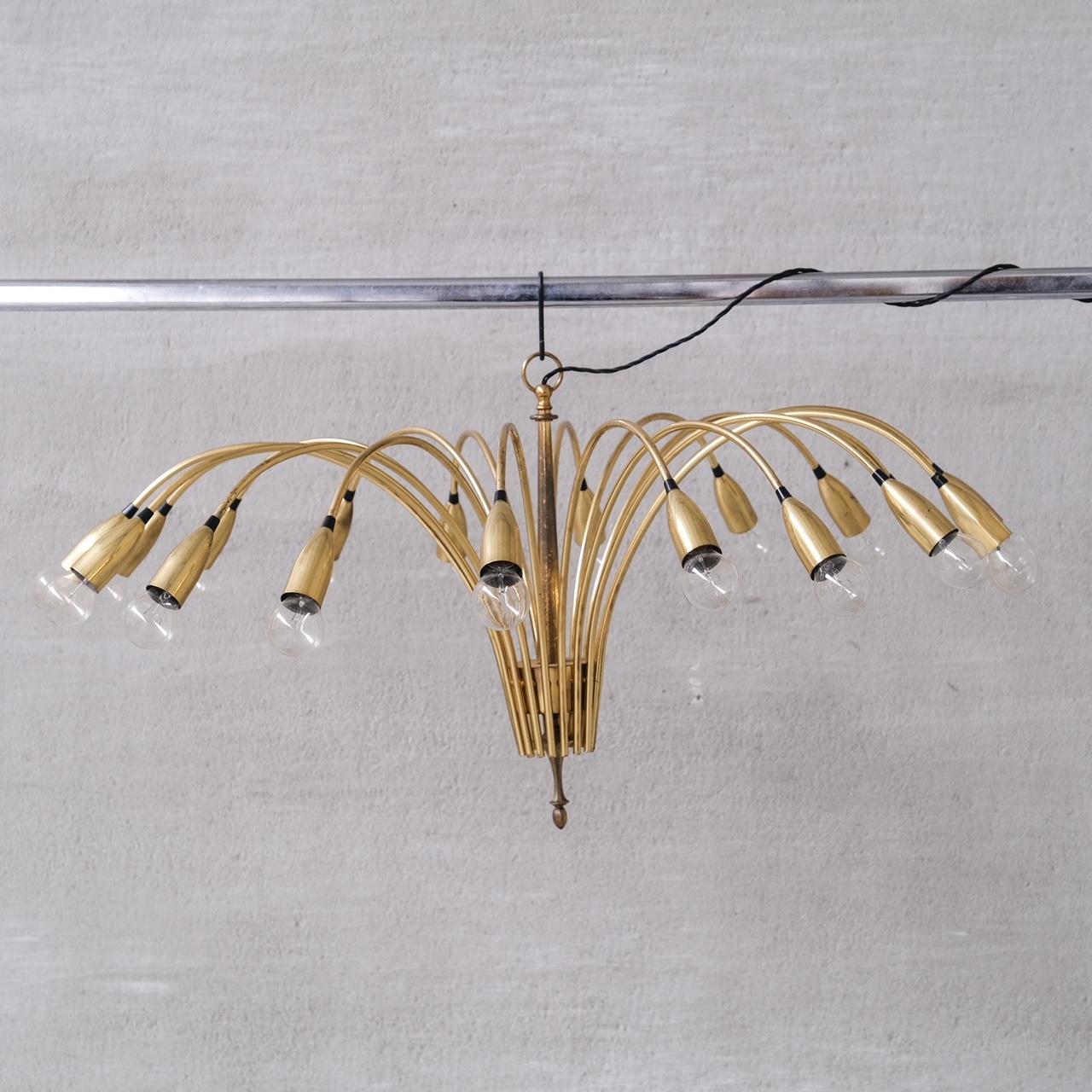A large brass chandelier.

Italy, c1970s.

18 arms make this an impactful light.

Since re-wired and PAT tested.

Good vintage condition, some scuffs and wear commensurate with age.

Internal Ref: 18/10/23/005.

Location: Belgium