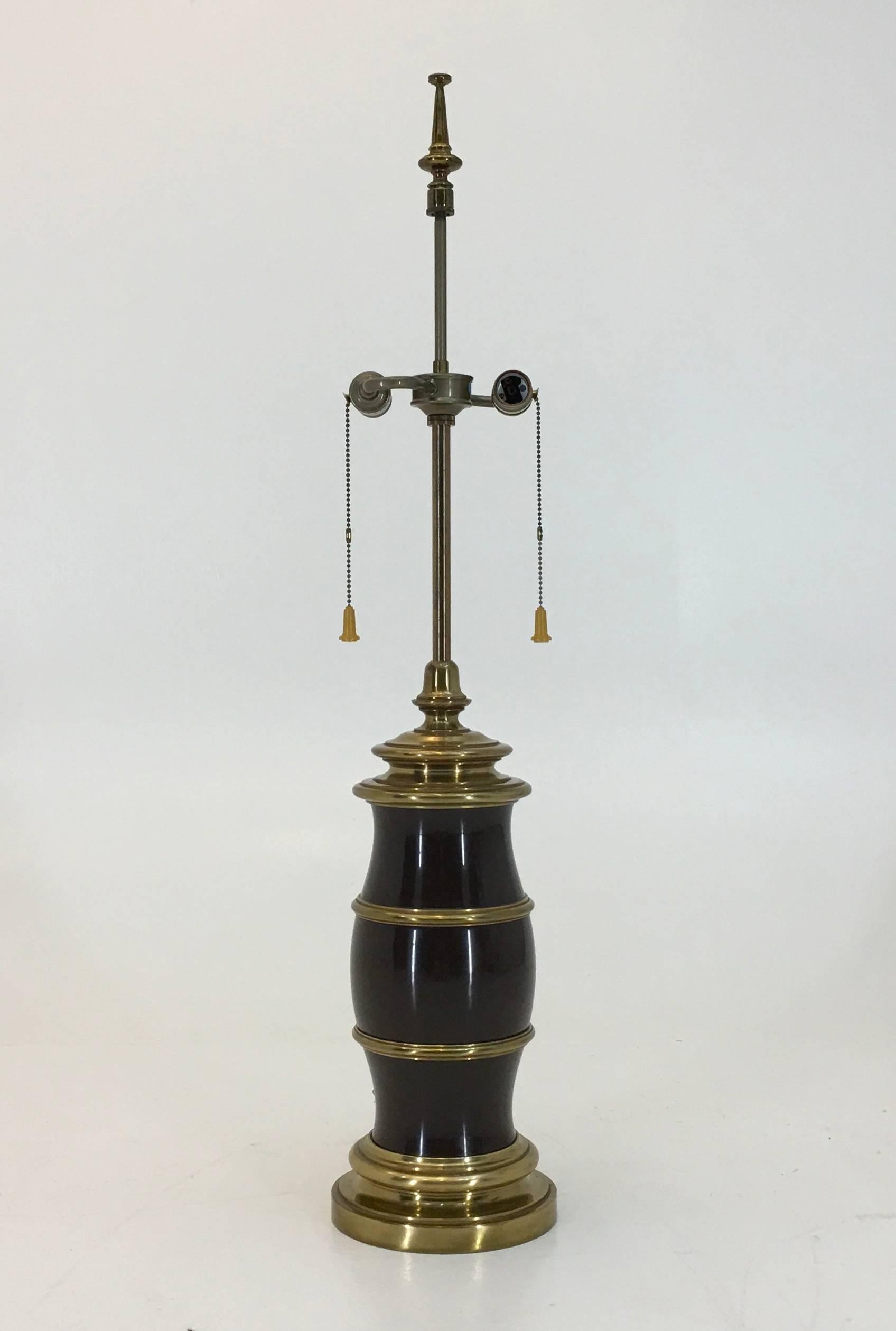 Stiffel, USA, Brass, brown enamel, bakelite, circa 1960, Measure: 38.25 tall x 7.75 inches wide
An exceptional lamp by Stiffel lighting. Even by Stiffel standards this is a very heavy lamp with a brown enamel over three sections of the brass.