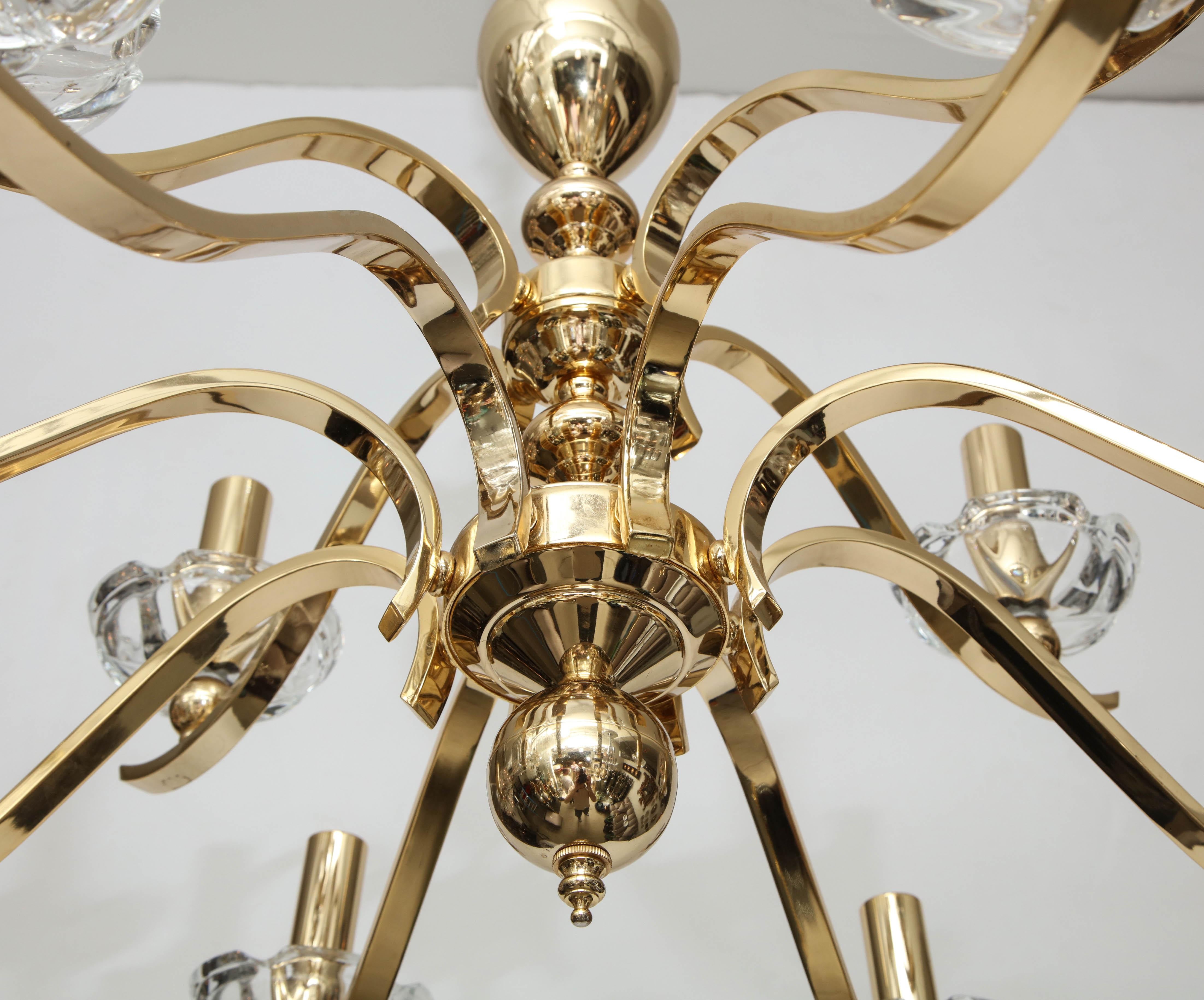 Large brass chandelier with twelve crystal bobeches.
The chandelier has been Newly rewired for the US and takes 
candelabra light bulbs.
It comes complete with chain and ceiling canopy.