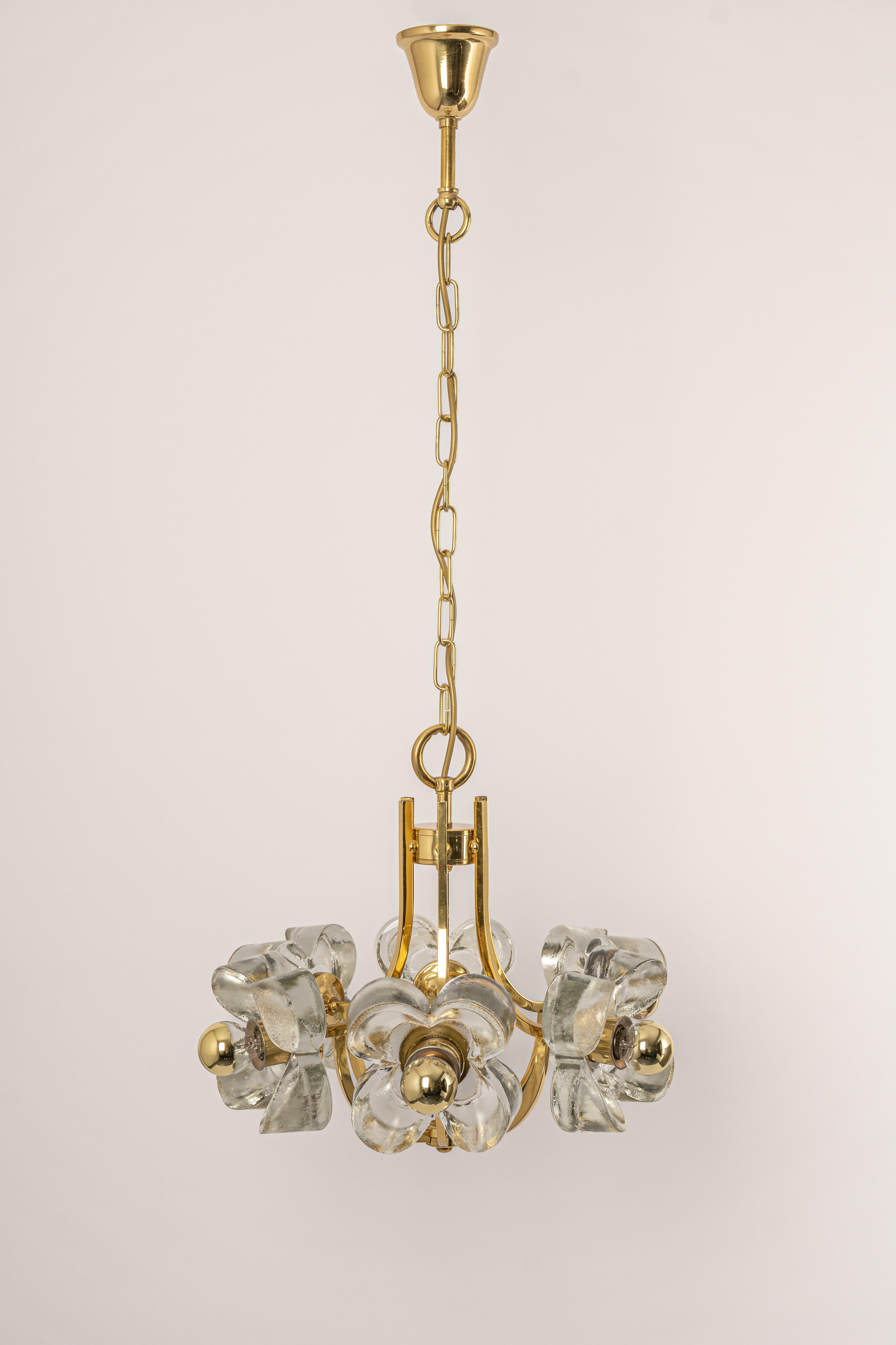 A wonderful large and high-quality gilded chandelier/pendant light fixture by Sische, Germany, 1970s

It is made of a brass frame decorated with 6 crystal glasses.
The lamp takes 6 small base bulbs (max. 40W per bulb).
Light bulbs are not included.