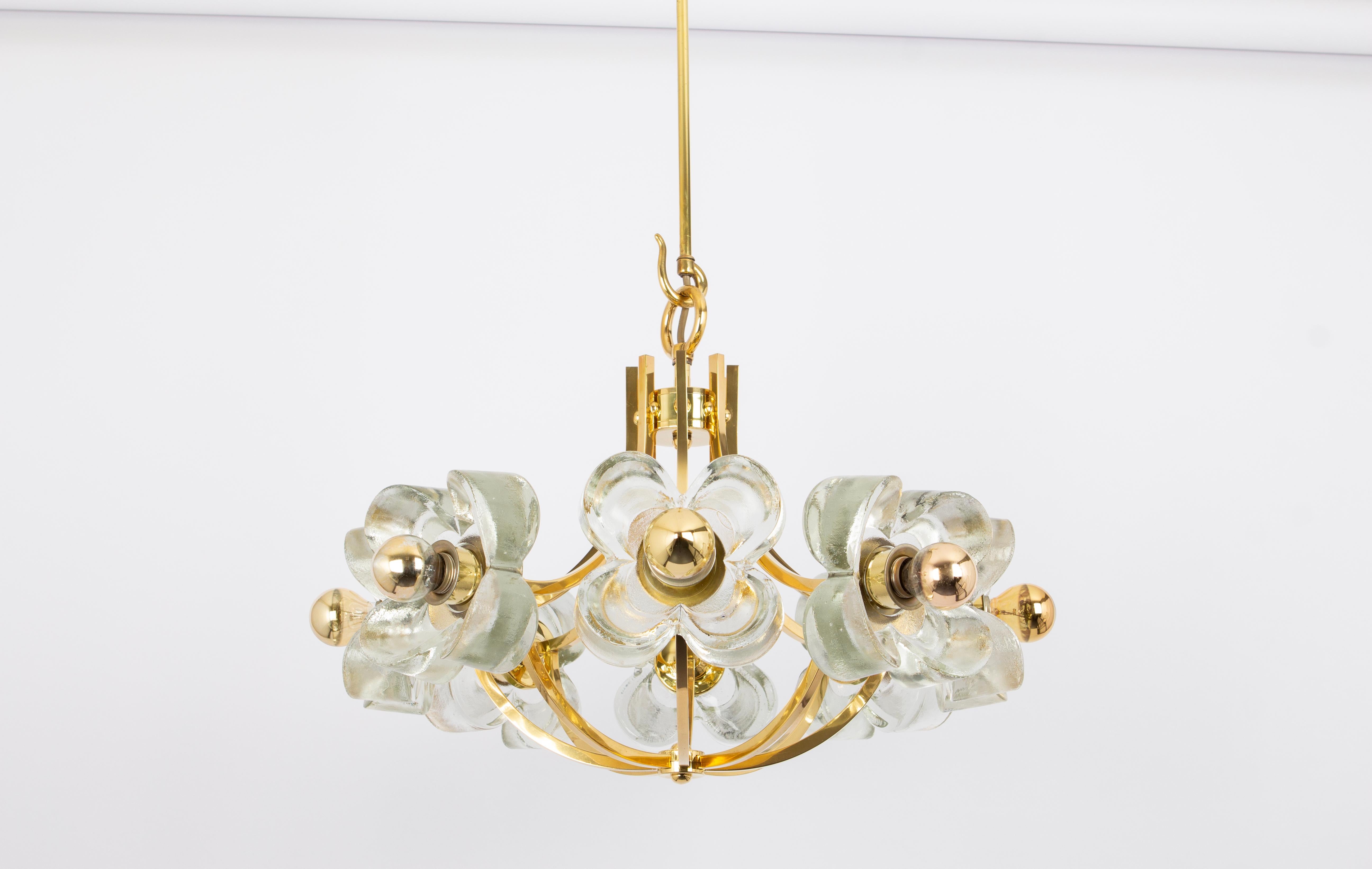 A wonderful large and high-quality gilded chandelier/pendant light fixture by Sische, Germany, 1970s

It is made of a brass frame decorated with 8 crystal glasses.
The lamp takes 8 small base bulbs (max. 40W per bulb).
Light bulbs are not included.