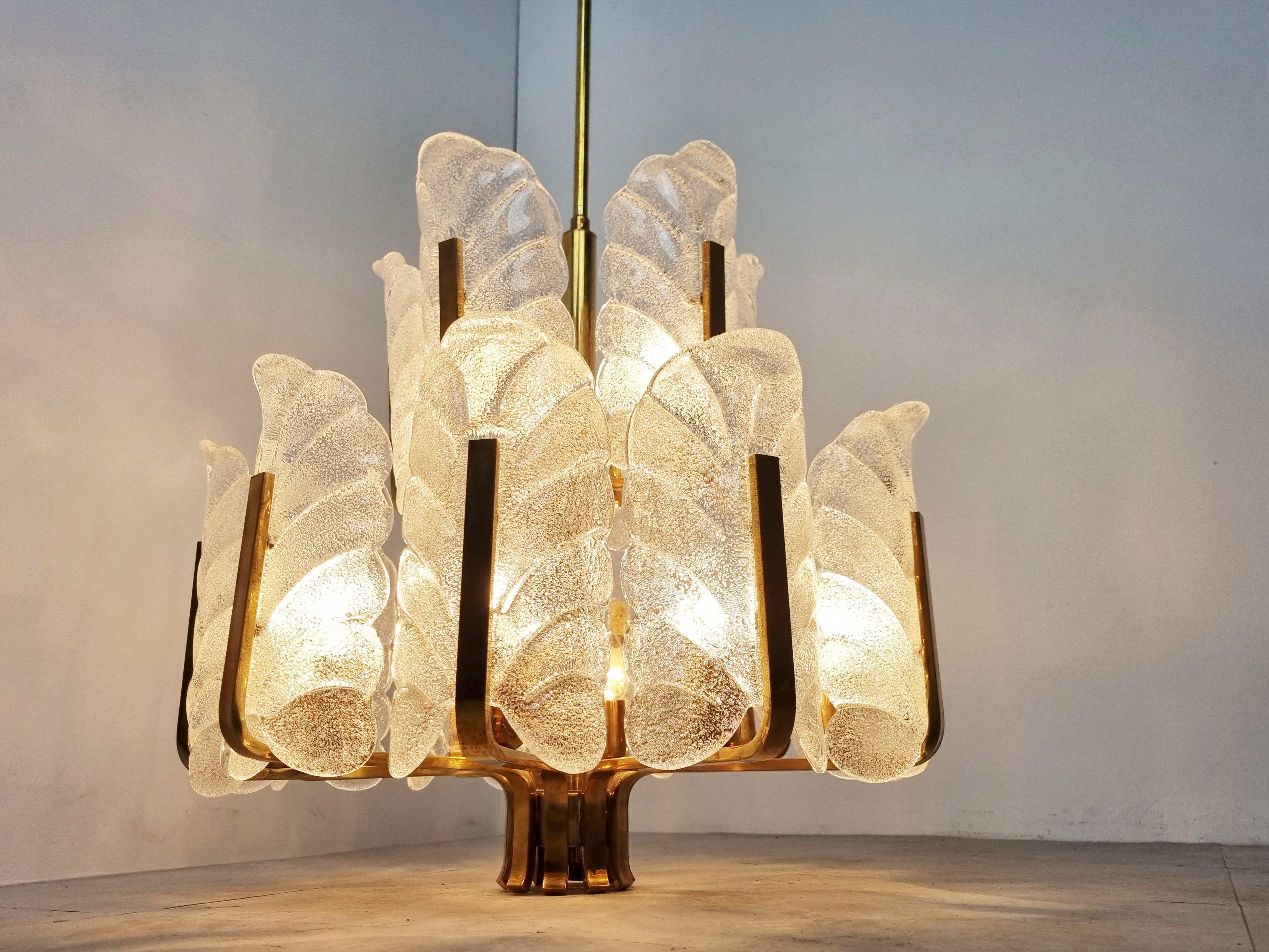 Impressive 15 armed brass chandelier designed by Carl Fagerlund for Orrefors.

It feautures 15 murano glass leaf shaped glass shades.

It emits a spectacular light.

Tested and ready to use with regular E14 light bulbs.

1960s -