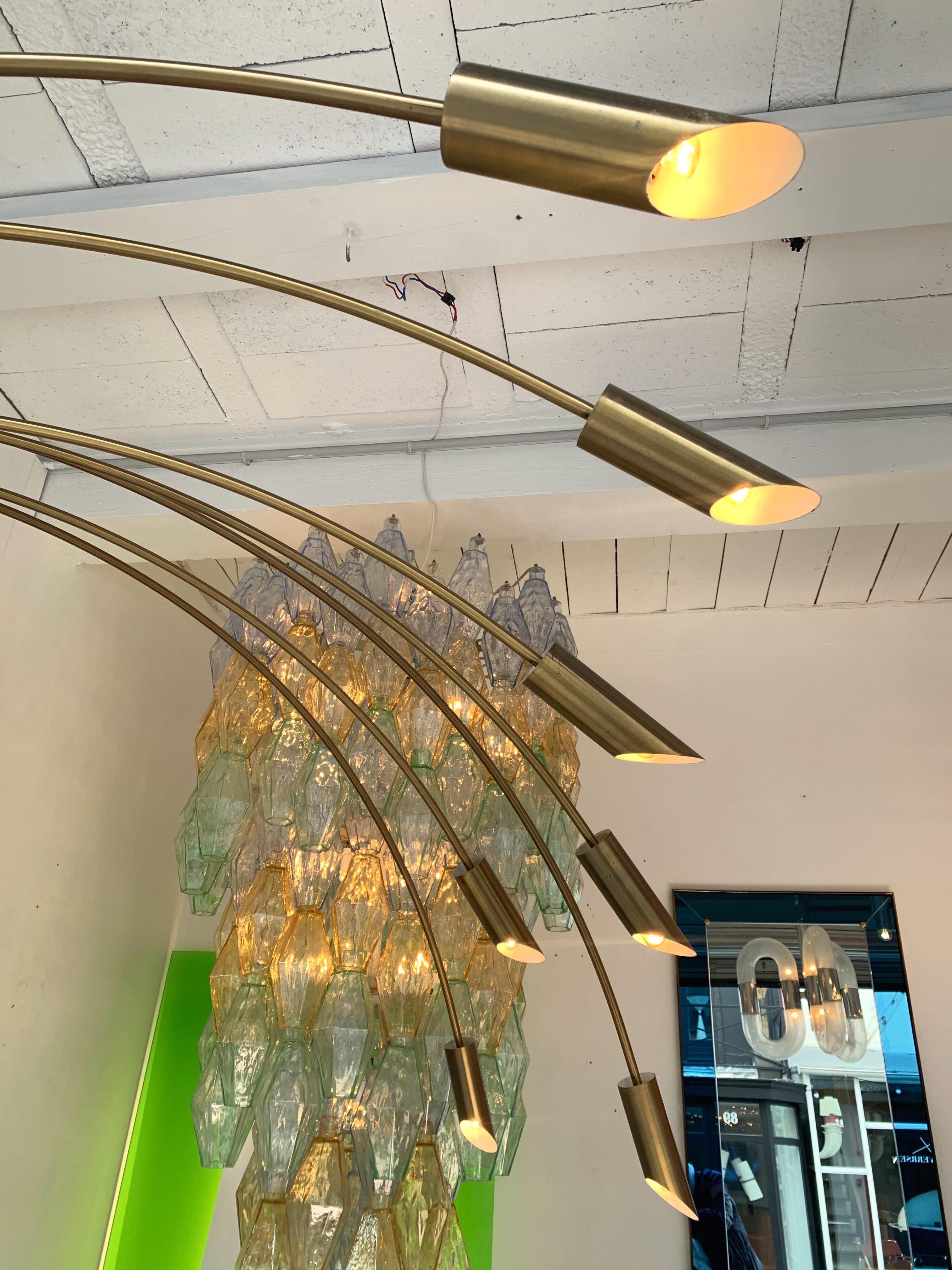 Very tall brass arc or arco floor lamp, black lacquered metal base. Nice patina. Arms can be positioned 360 degrees. measurements based on the floor lamp position on the photos.