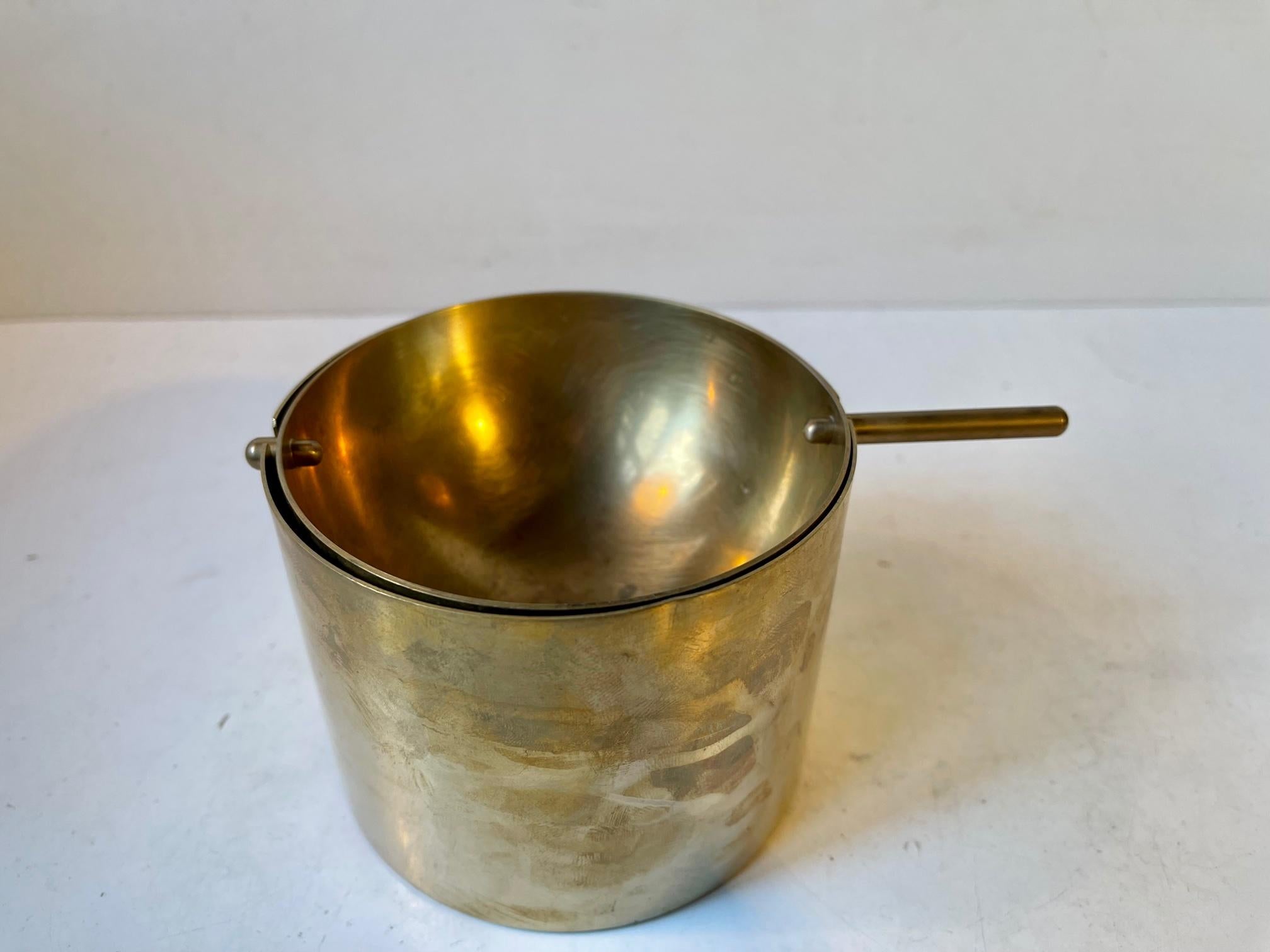 This brass version of the Cylinda-line ashtray was designed by Arne Jacobsen and manufactured by Stelton in a limited run from 1965-67. This, the large version or Cigar Ashtray, is by far the rarest of the two sizes they came in. The nice thing