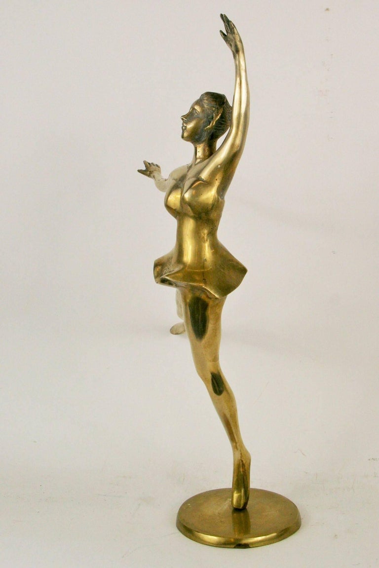 Large brass ballerina sculpture on brass base.