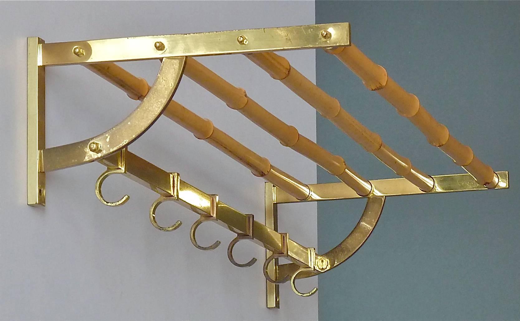 Stunning and exceptional modernist coat rack or wall wardrobe, which has been designed and executed in the 1950s in Austria, probably it belongs to one of the wonderful designs by Auböck, Hagenauer, Josef Frank for Haus & Garten or Kalmar. It is
