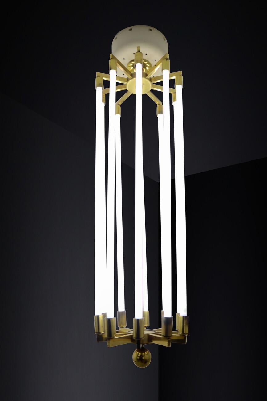 Large Brass Bauhaus Chandelier by Kaiser & Co., Germany, Circa 1930s — 2 Available, Price Per Item

A rare and commanding example of early Bauhaus-era lighting, this large chandelier was manufactured by Kaiser & Co. in Germany circa 1930. With its
