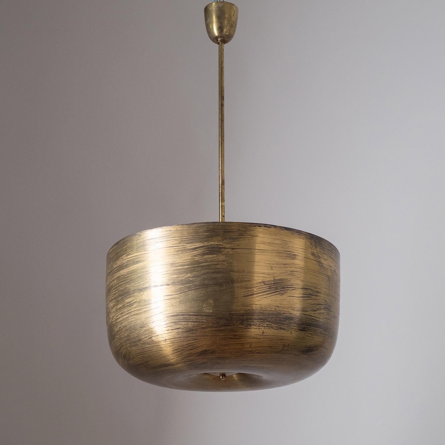 Rare oversize brass bowl chandelier, circa 1930. Made from a single piece of turned brass and with a height of 10inches/25cm the brass bowl has an exceptional sculptural quality with a beautifully aged patina. Four nickel and ceramic E27 sockets