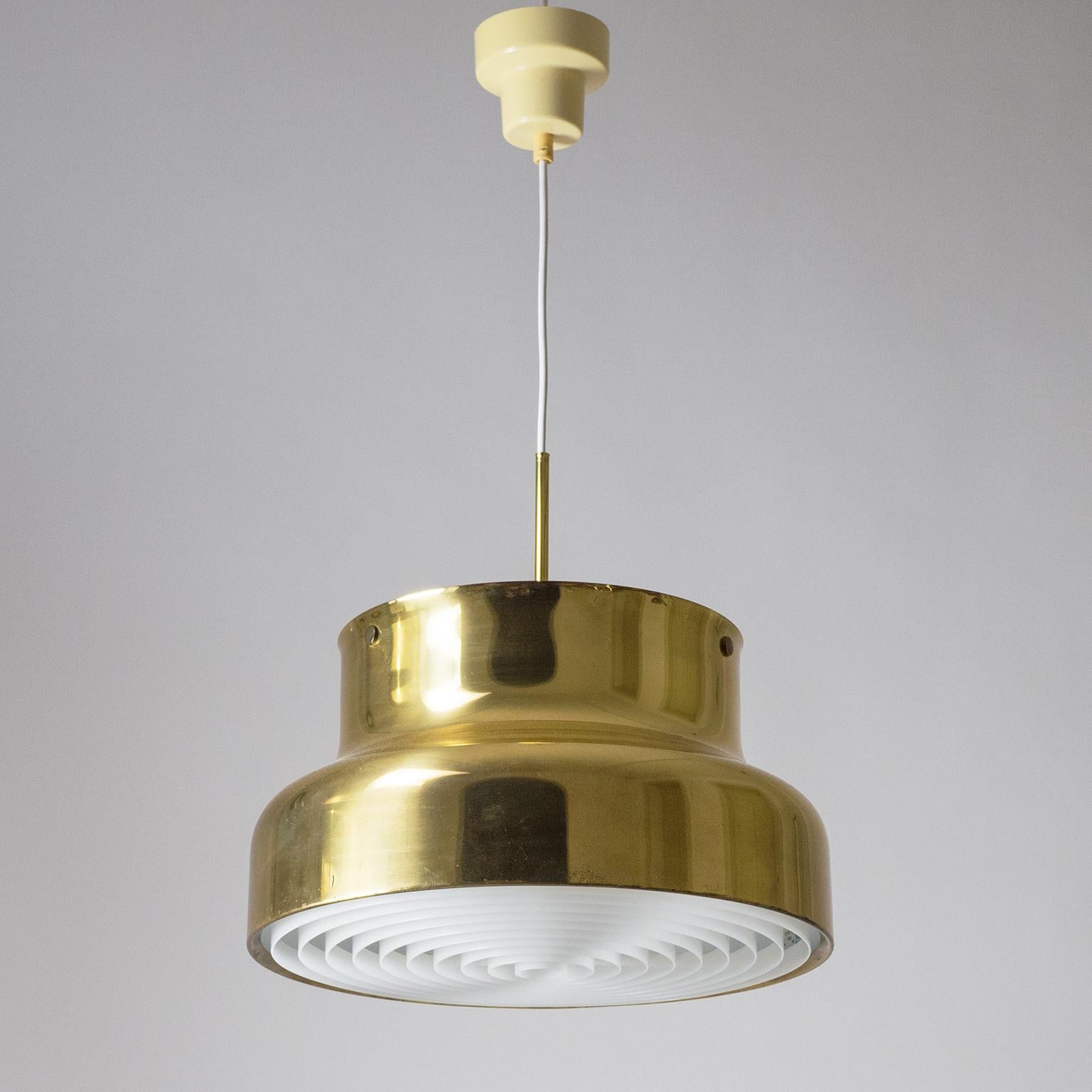 Large brass 'Bumling' pendant by Anders Pherson from the 1970s. Fine condition with a lovely patina on the brass. Brand new acrylic diffuser as well as new wiring to the two original E27 sockets. Please note that the on/off switch on top of the
