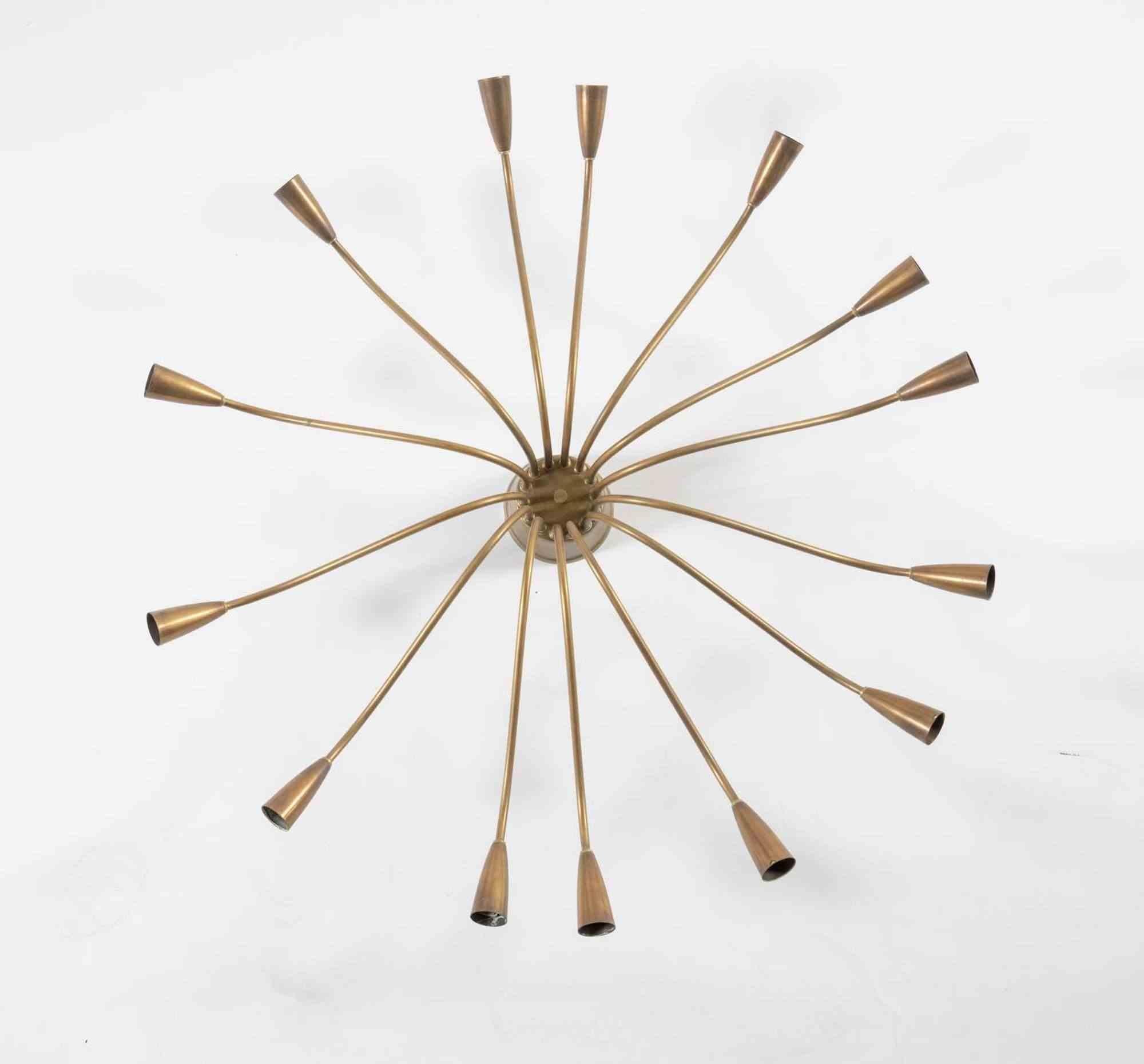 Large brass ceiling lamp, 1950s. 

Italian production.

It has 14 lights arranged in a radial pattern.

Diameter 90 cm 

Good condition, only minor signs of wear.
