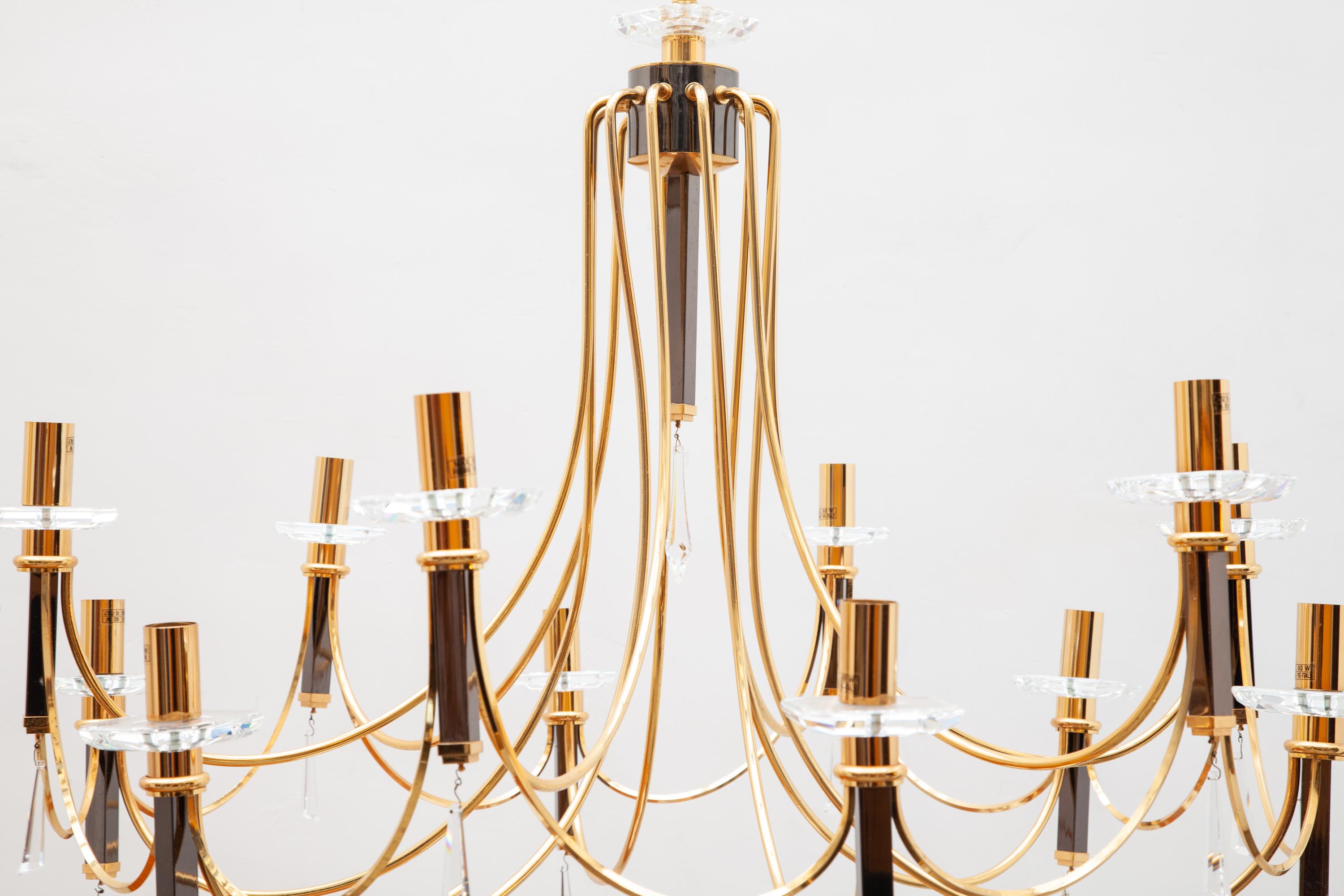 Chandelier by Italian manufacturer Prearo a creation of a fine piece of art of a classical model features stylish faceted crystal glass accents and 12 light bulbs with base E14.
Materials - brass-plated steel, glass crystals.