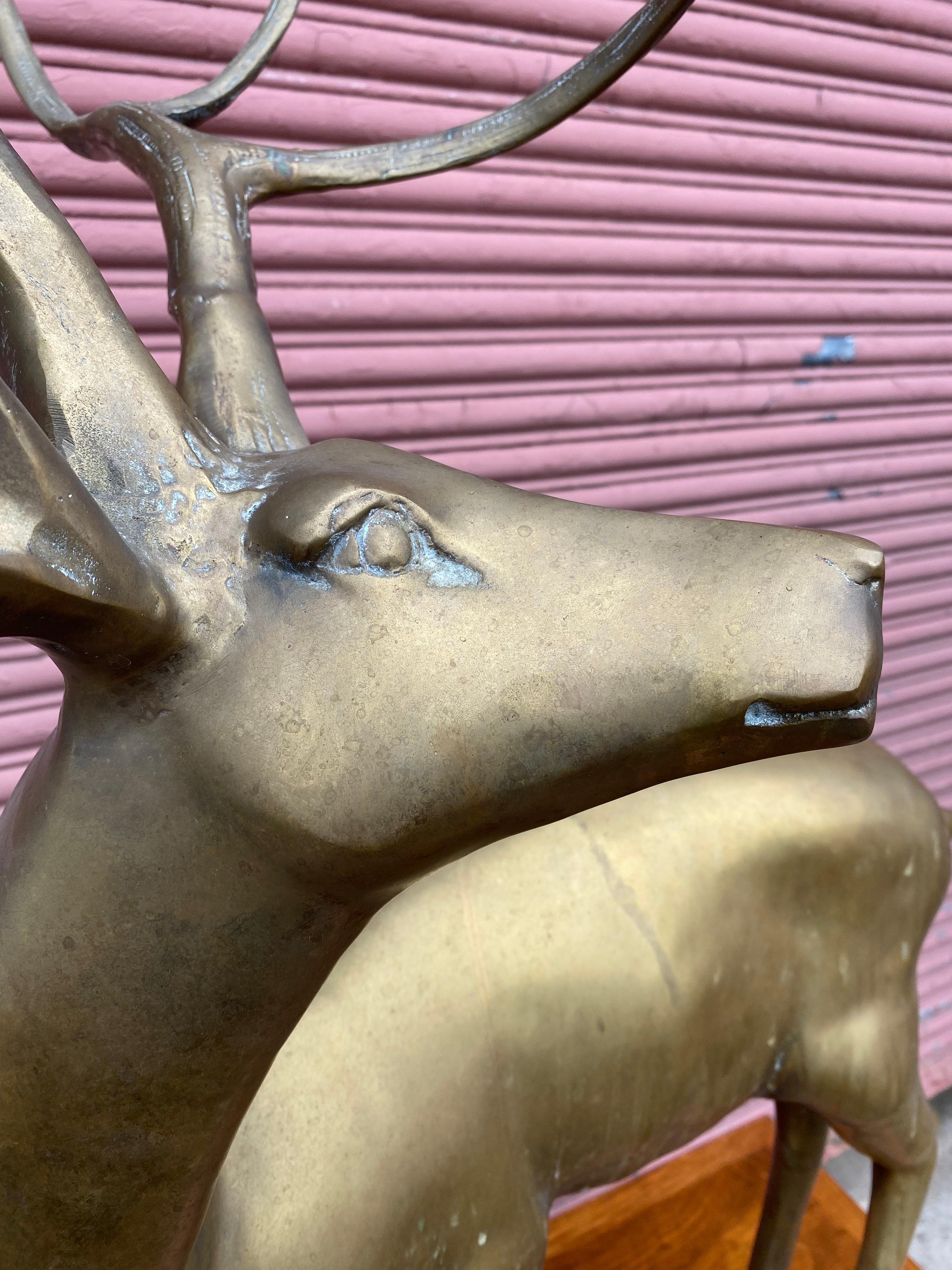 large brass deer sculpture