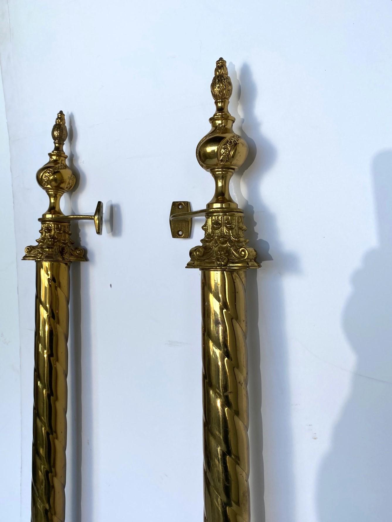 A huge pair of impressive brass door handles. Barley twist center column with Corinthian caps and finished top and bottom with decorated finials.