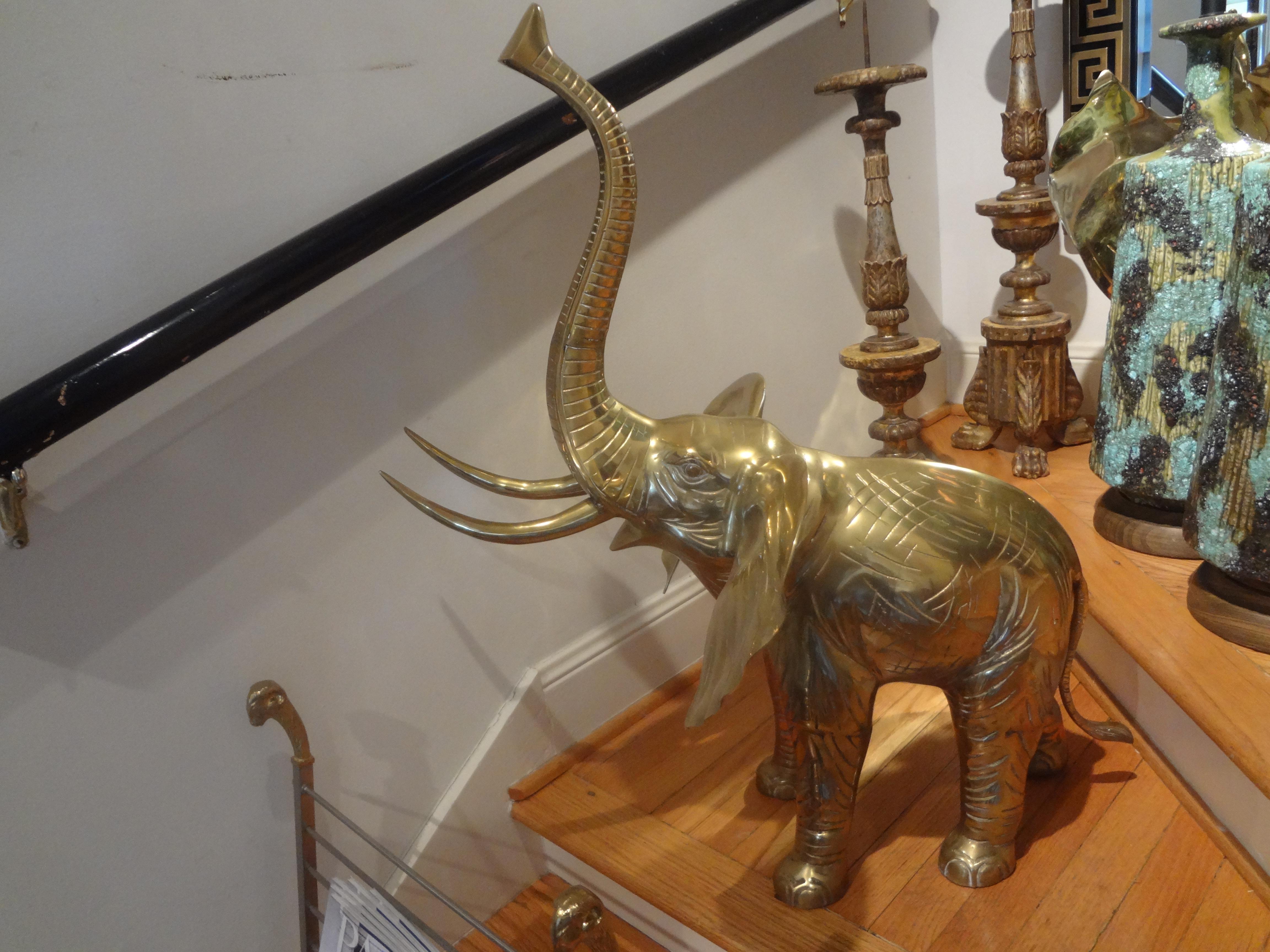 Large brass elephant statue. This stunning realistic Hollywood Regency brass elephant figure or sculpture has great detailing and patina.