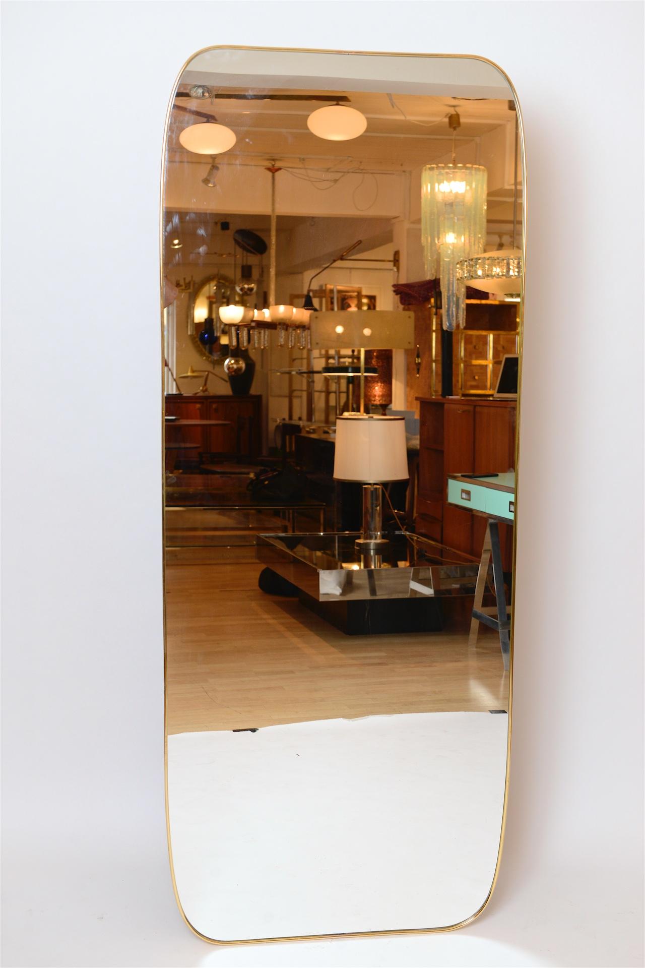 Brass framed Italian mirror. Can be a floor standing mirror or hang either way. 

Pairs available.