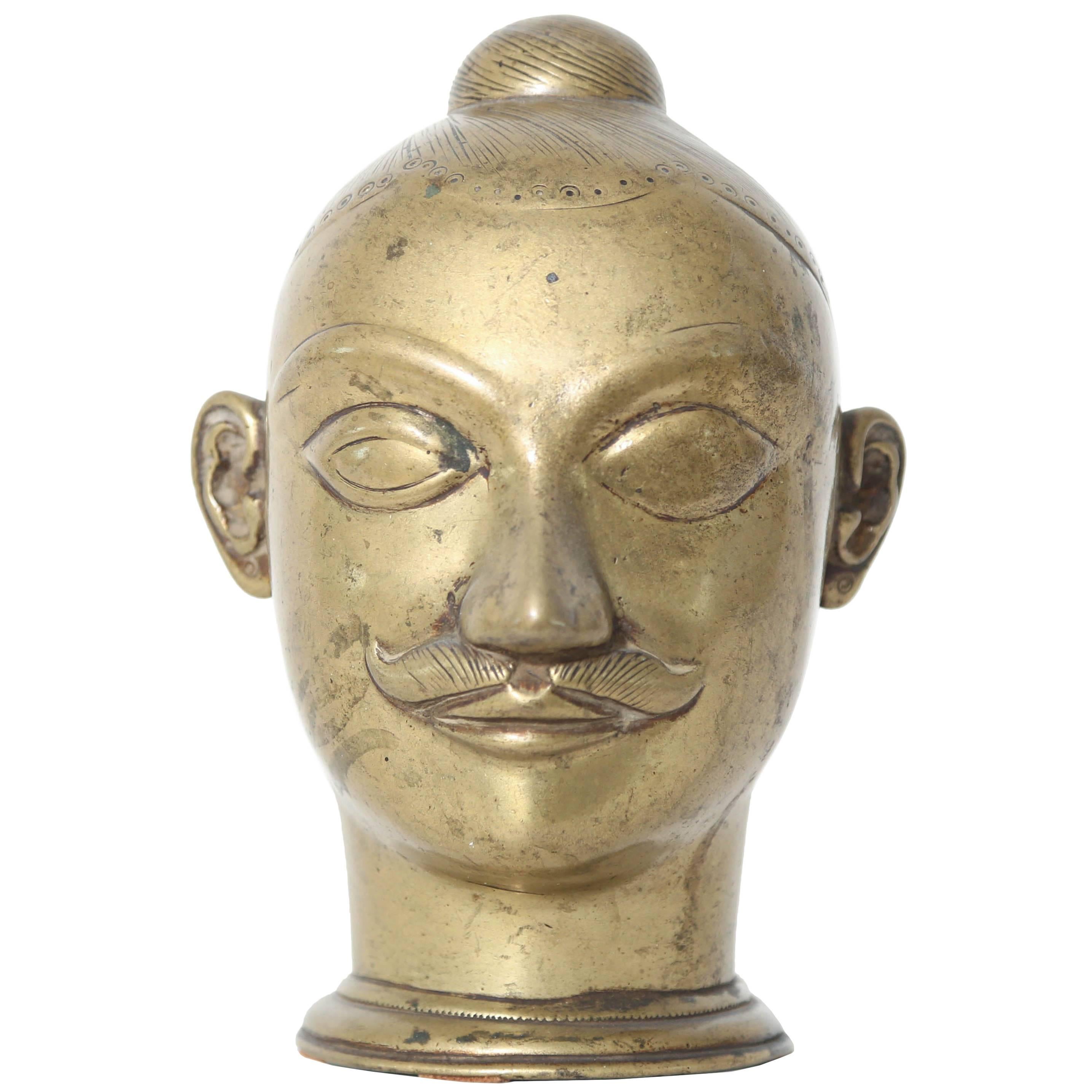 Large Brass Lingam Cover in the form of a Head, India, 18th Century