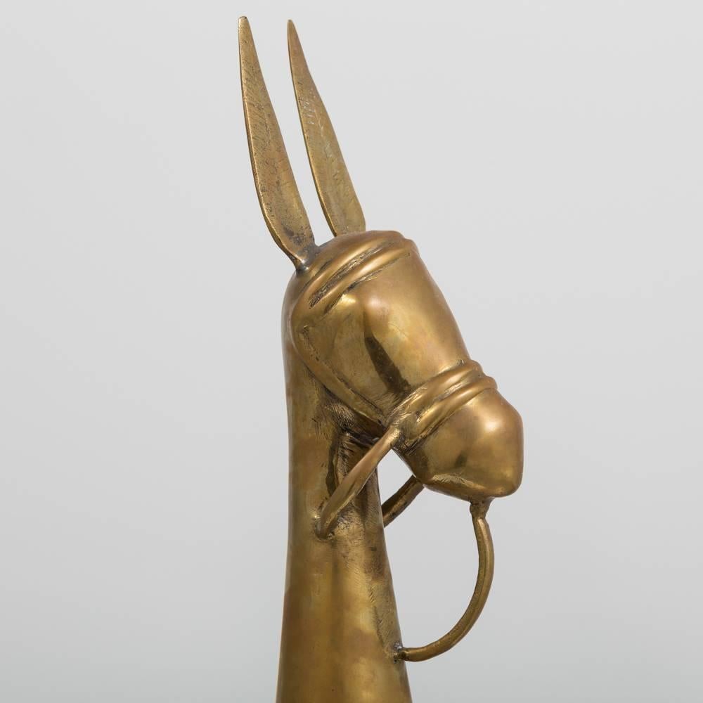 Large vintage brass stylized llama (donkey/alpaca/mule) sculpture with halter detail. The brass is tarnished and pitted fitting with its age, 1970s.
 