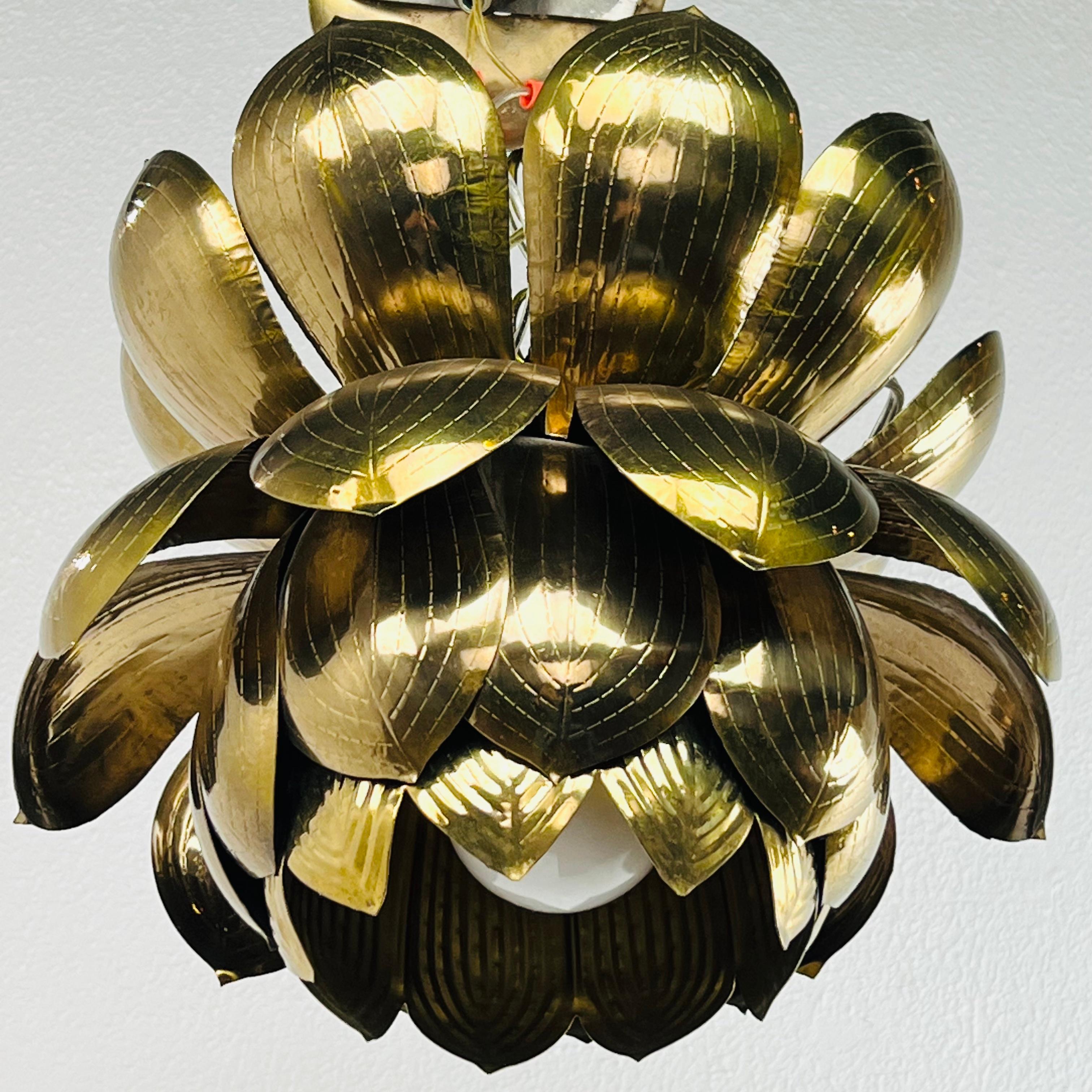 A show stopper and the epitome of glam. Large Parzinger style brass lotus pedant fixture by Feldman Lighting Company. The largest of the Feldman Lotus Fixtures - and often described as in the style of Tommi Parzinger - this pendant has a beautiful