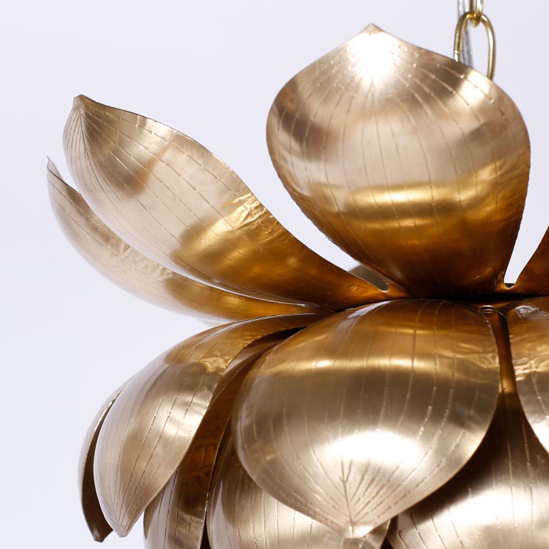 Chic midcentury lotus pendant or light fixture with an exotic ambiance, crafted in brass, hand polished and lacquered for easy care. Probably Feldman with a smaller pair also available, as shown in the last photo of the listing.