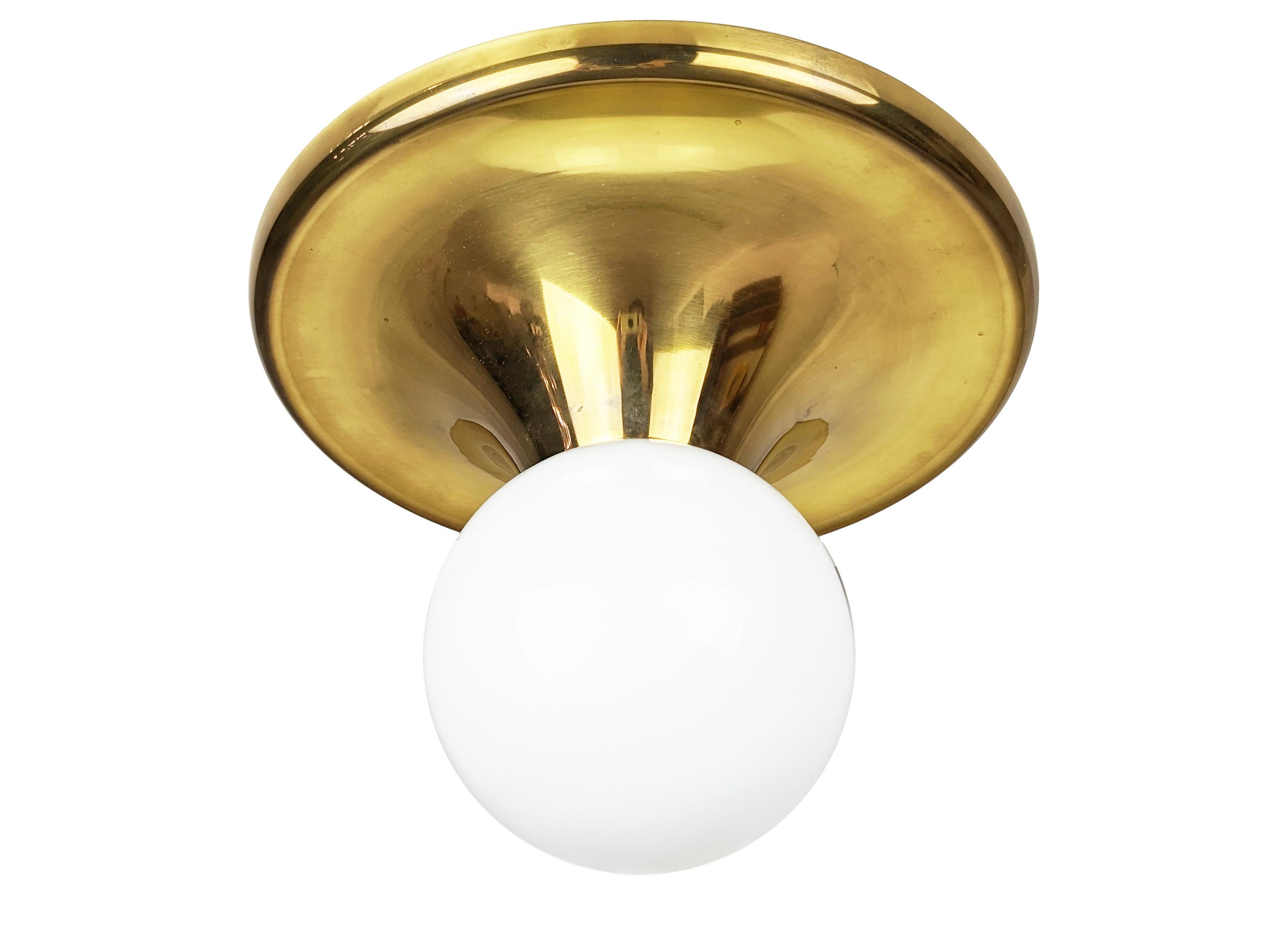 Larger version (cm 40 diameter) of the light ball serie designed by Achille Castiglioni for Arteluce and Flos in 1960s. Aluminum & polished brass body with white opaline shade. Very good condition.