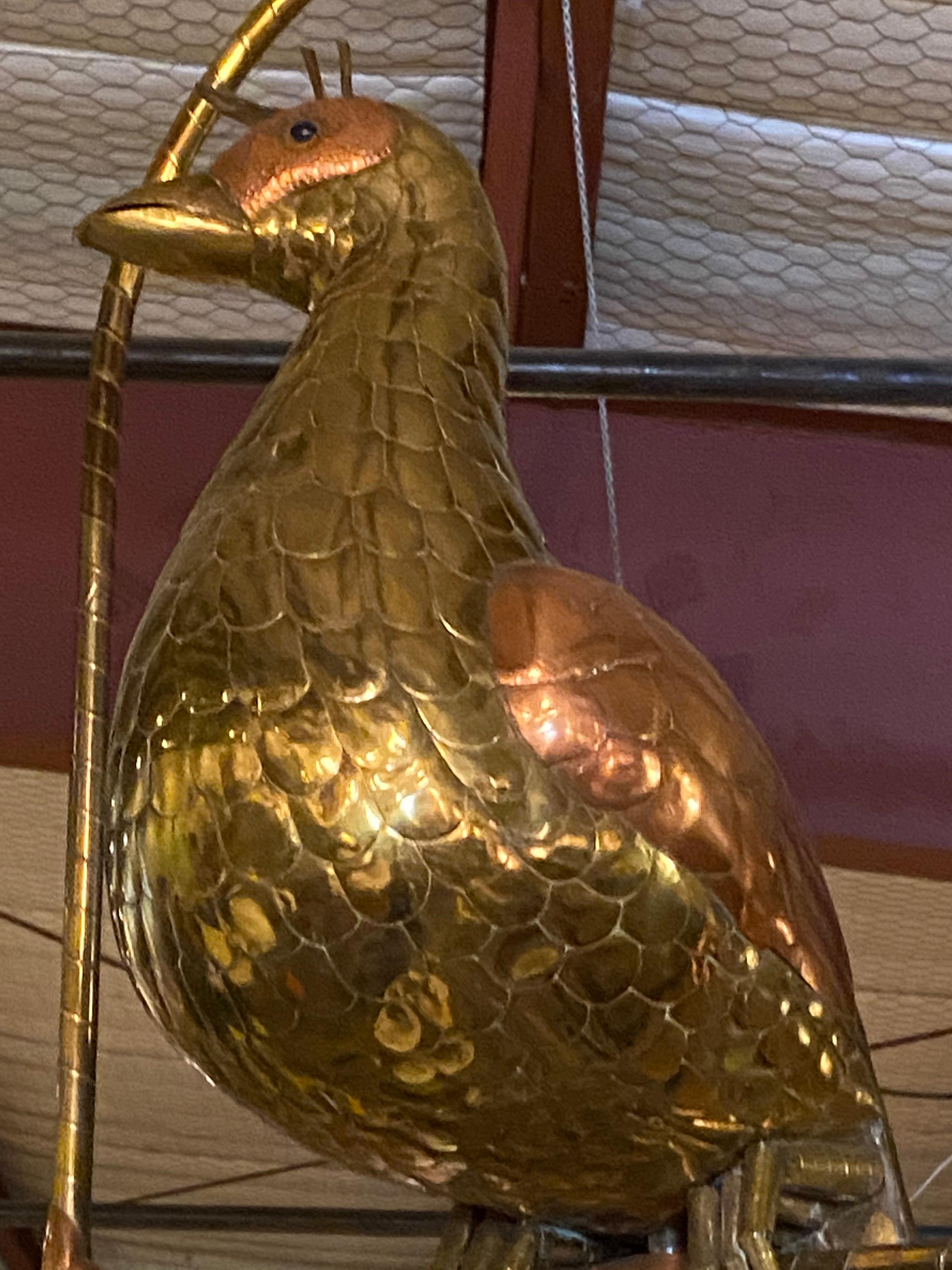 Beautiful decorative exotic peacock designed by Mexican artist and sculptor, Sergio Bustamante. Bustamante is known for his stunning bronze and metal pieces. This brass peacock is missing three feathers from its crest but in overall good condition.