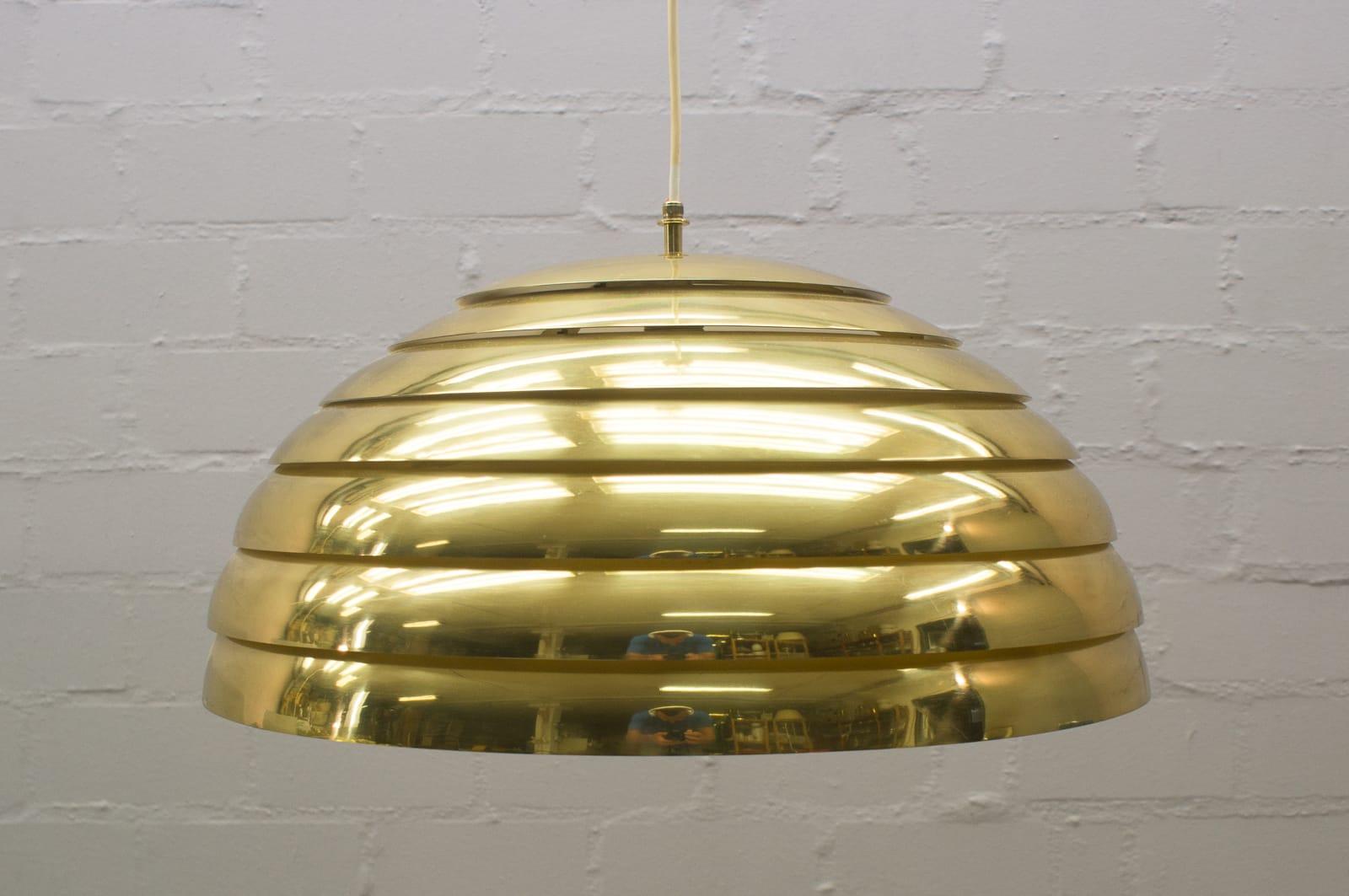 Large pendant lamp. Manufactured by Vereinigte Werkstätten Munich or Germany in 1960s. Massive brass sheet and Lucite diffuser. 
The height of the shade is 30cm, complete 100cm.

 